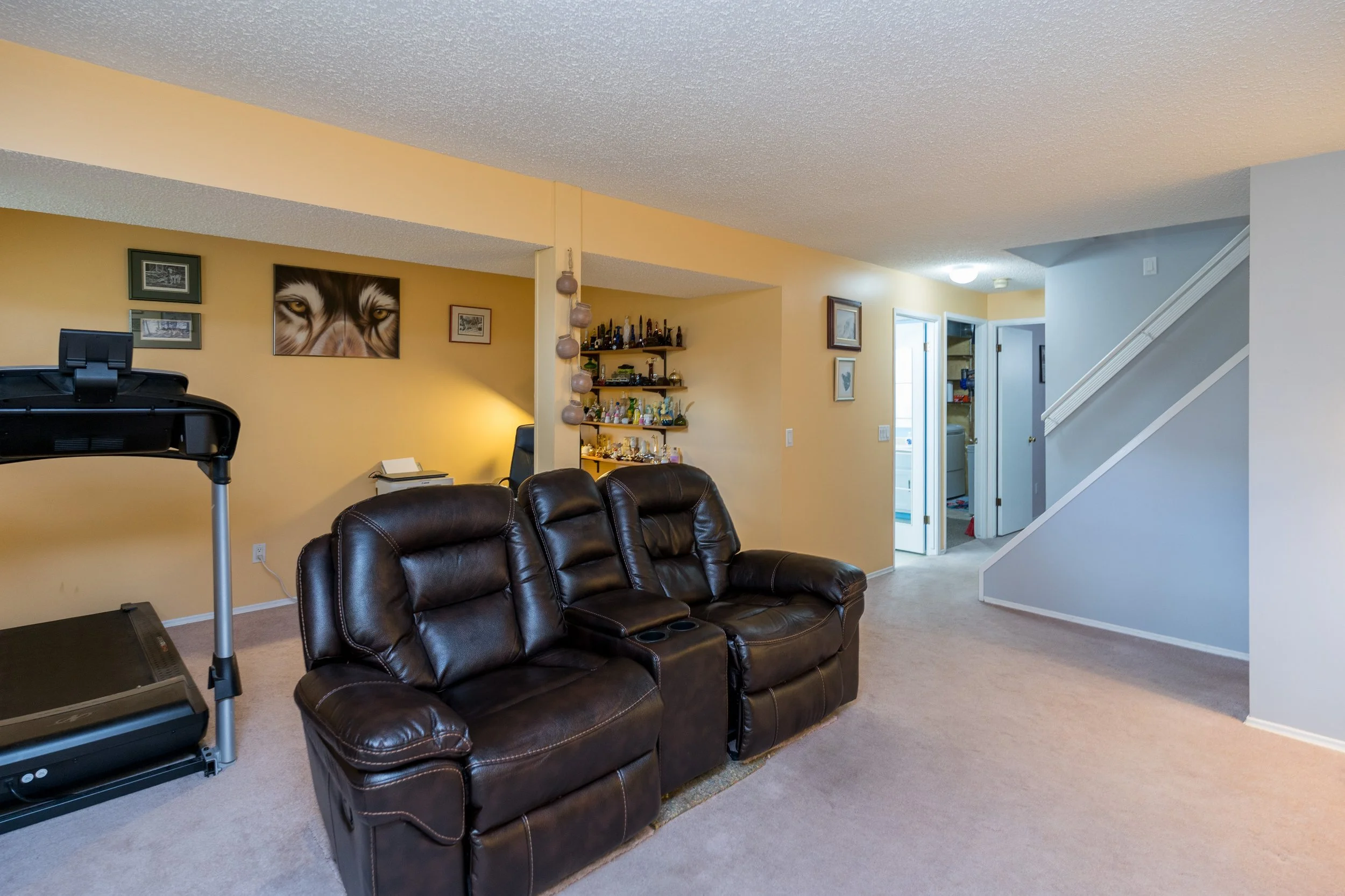 022 Lower level family room with gas fireplace in bi-level home.jpg