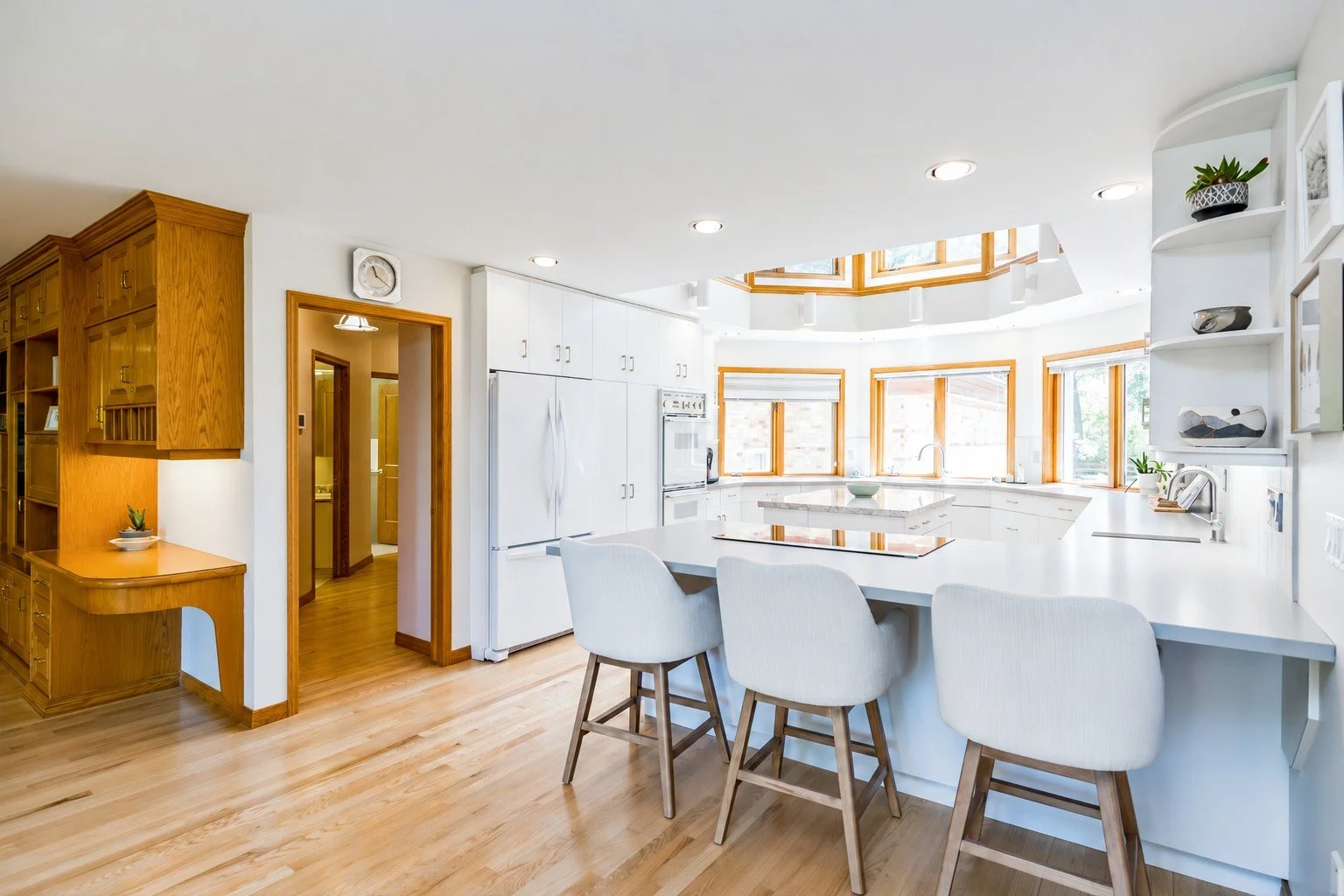 012 Bright kitchen with white cabinetry and abundant storage.jpg