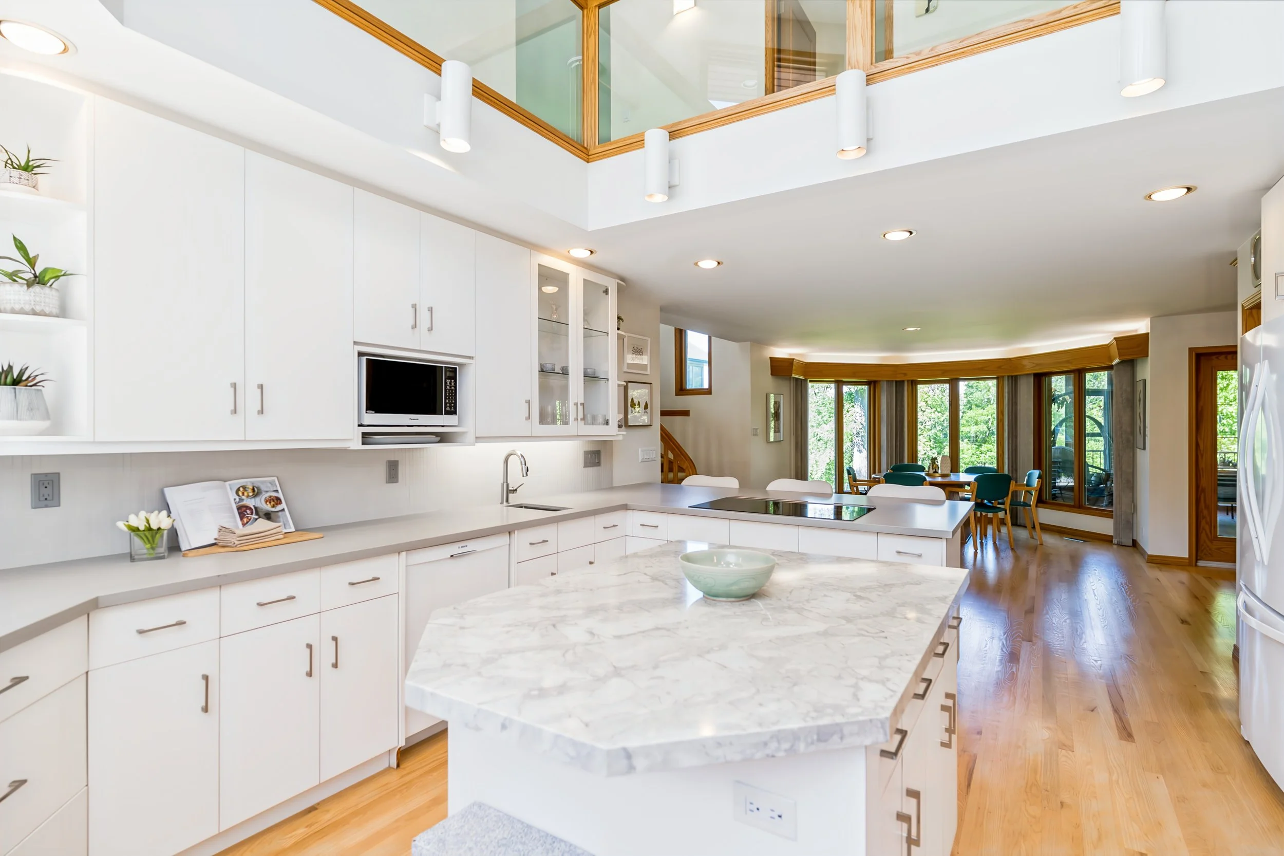 015 Quartz countertop kitchen with sunny dining area.jpg