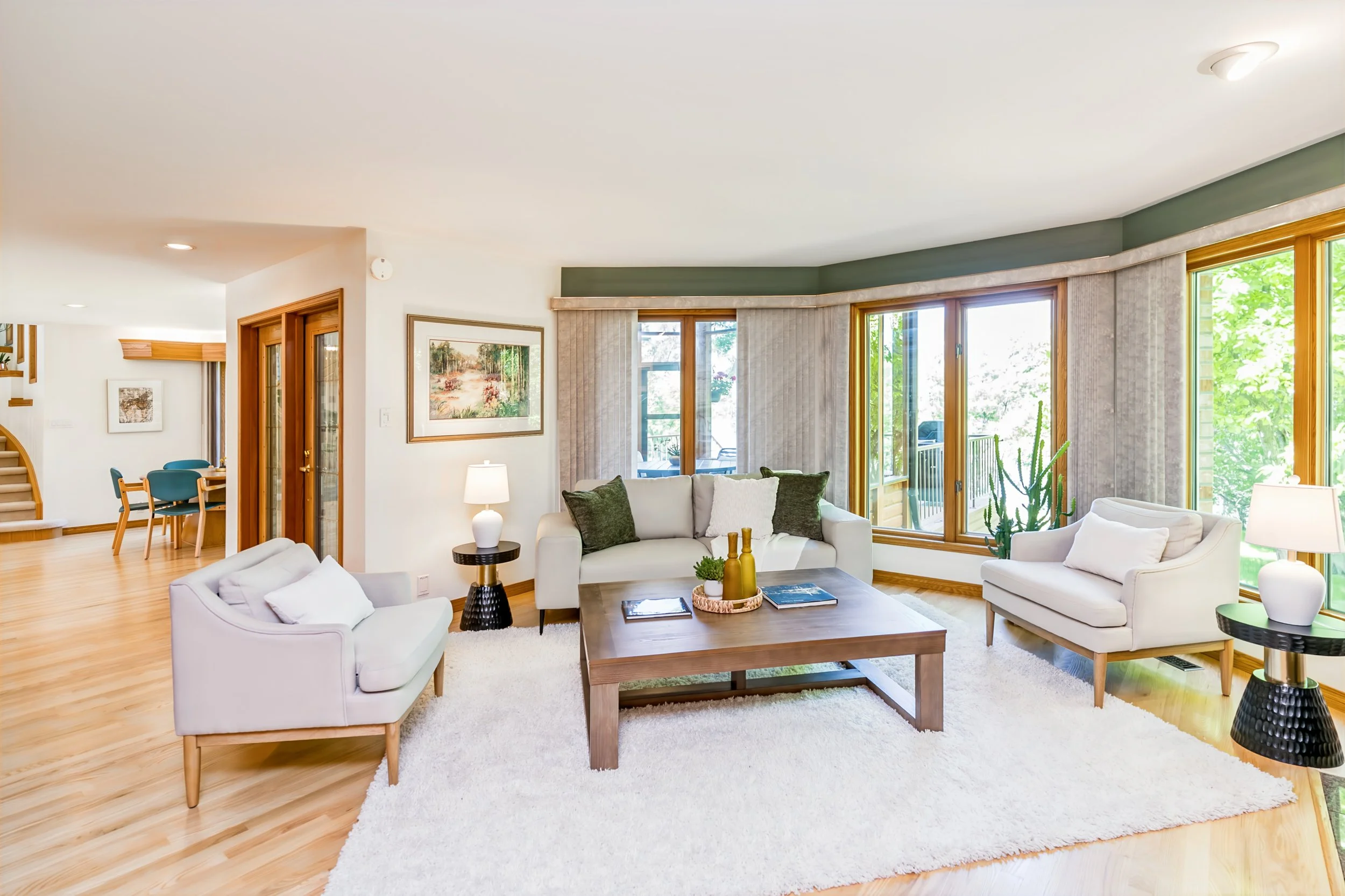 027 Riverfront family room with expansive backyard windows.jpg