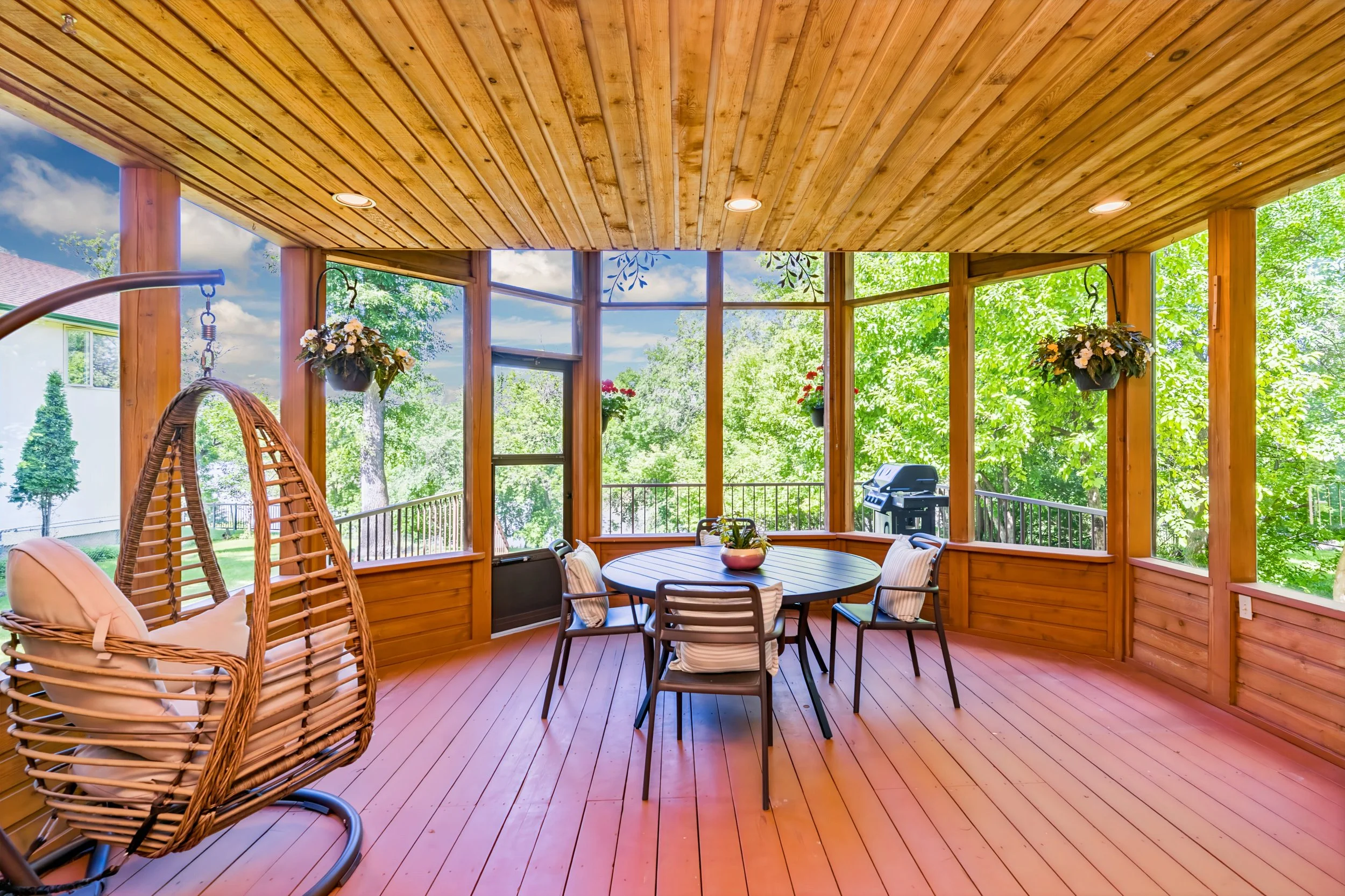 038 Large two-storey screened-in sunroom with backyard views.jpg