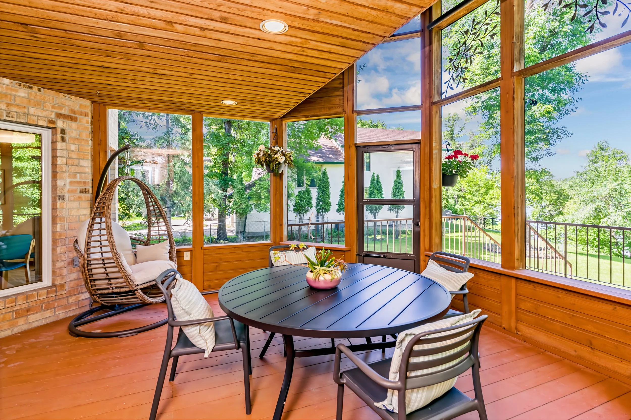 039 Screened sunroom overlooking mature riverfront property.jpg
