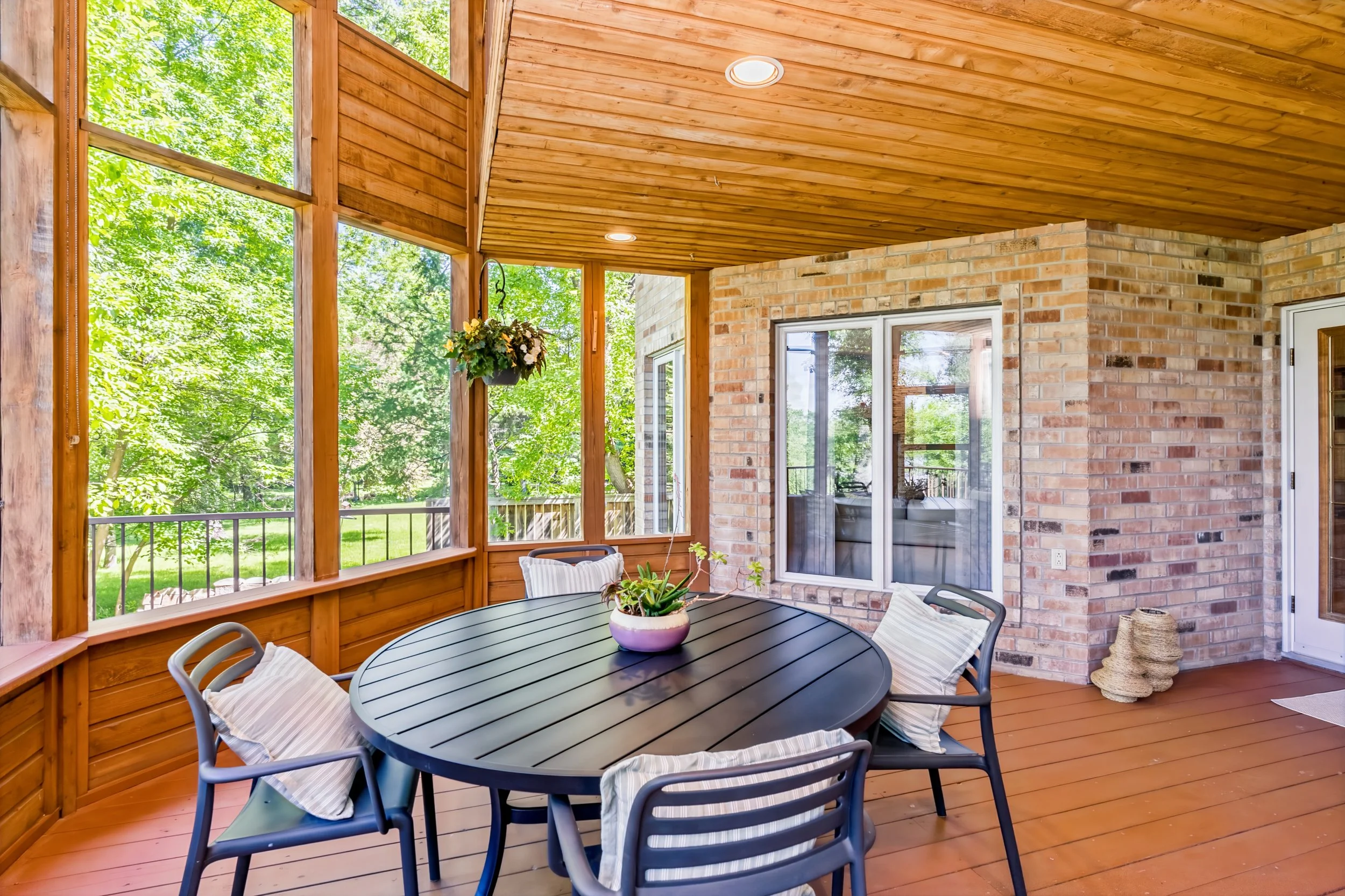 041 Two-storey sunroom offering peaceful outdoor living space.jpg