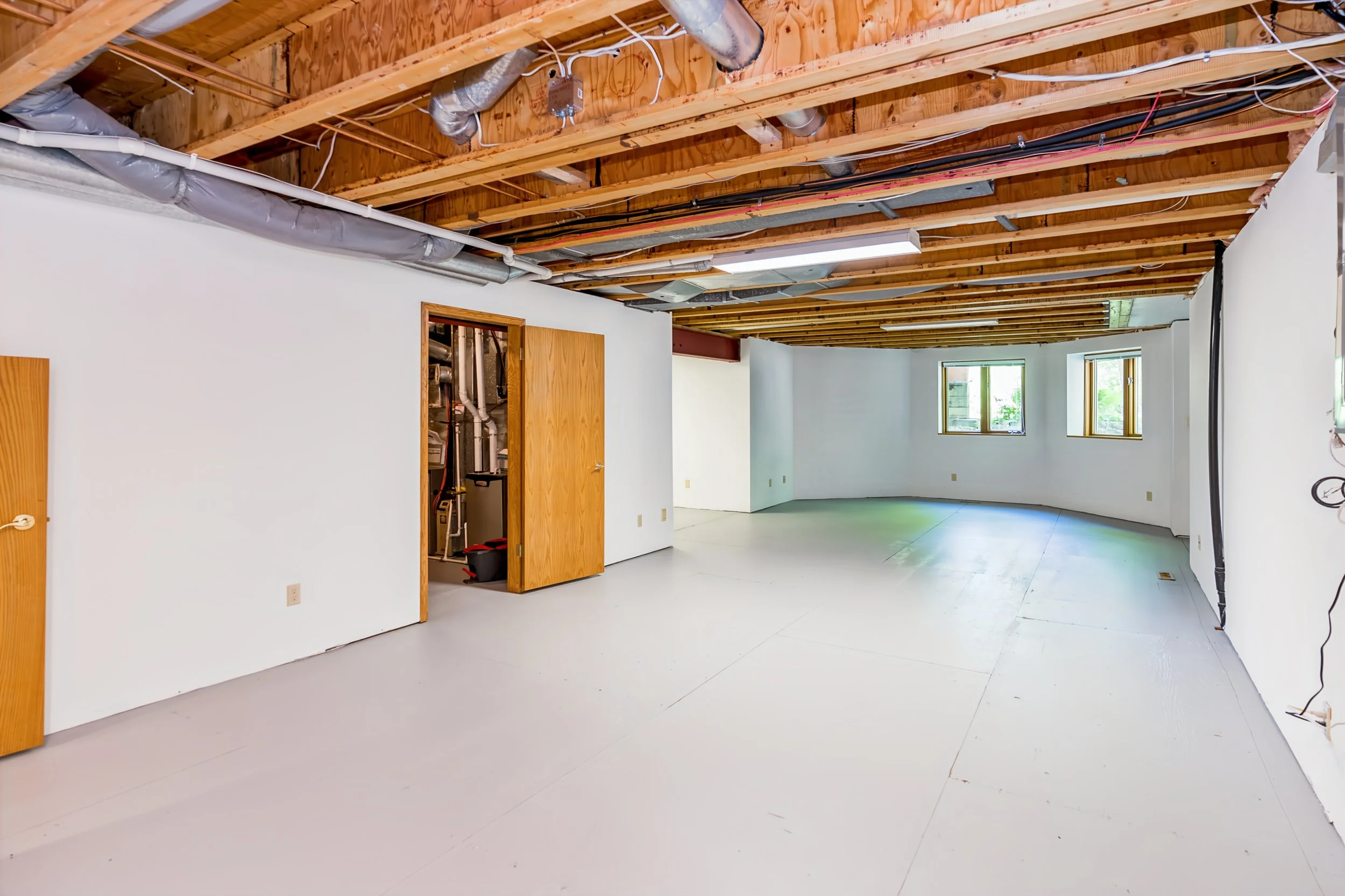 076 Future bathroom rough-ins in walkout basement.jpg