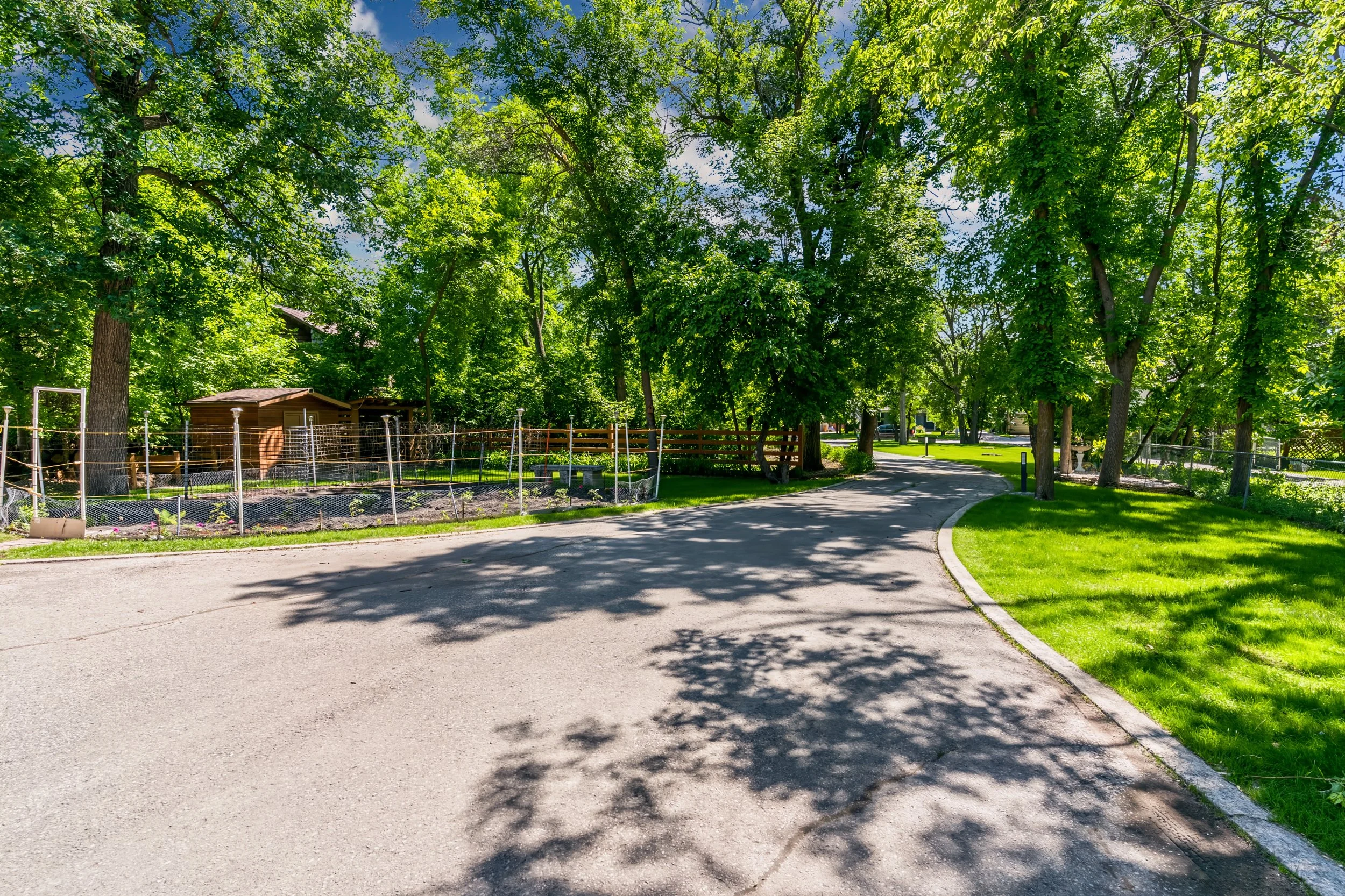 094 Riverfront residence with grand driveway and timeless curb appeal.jpg