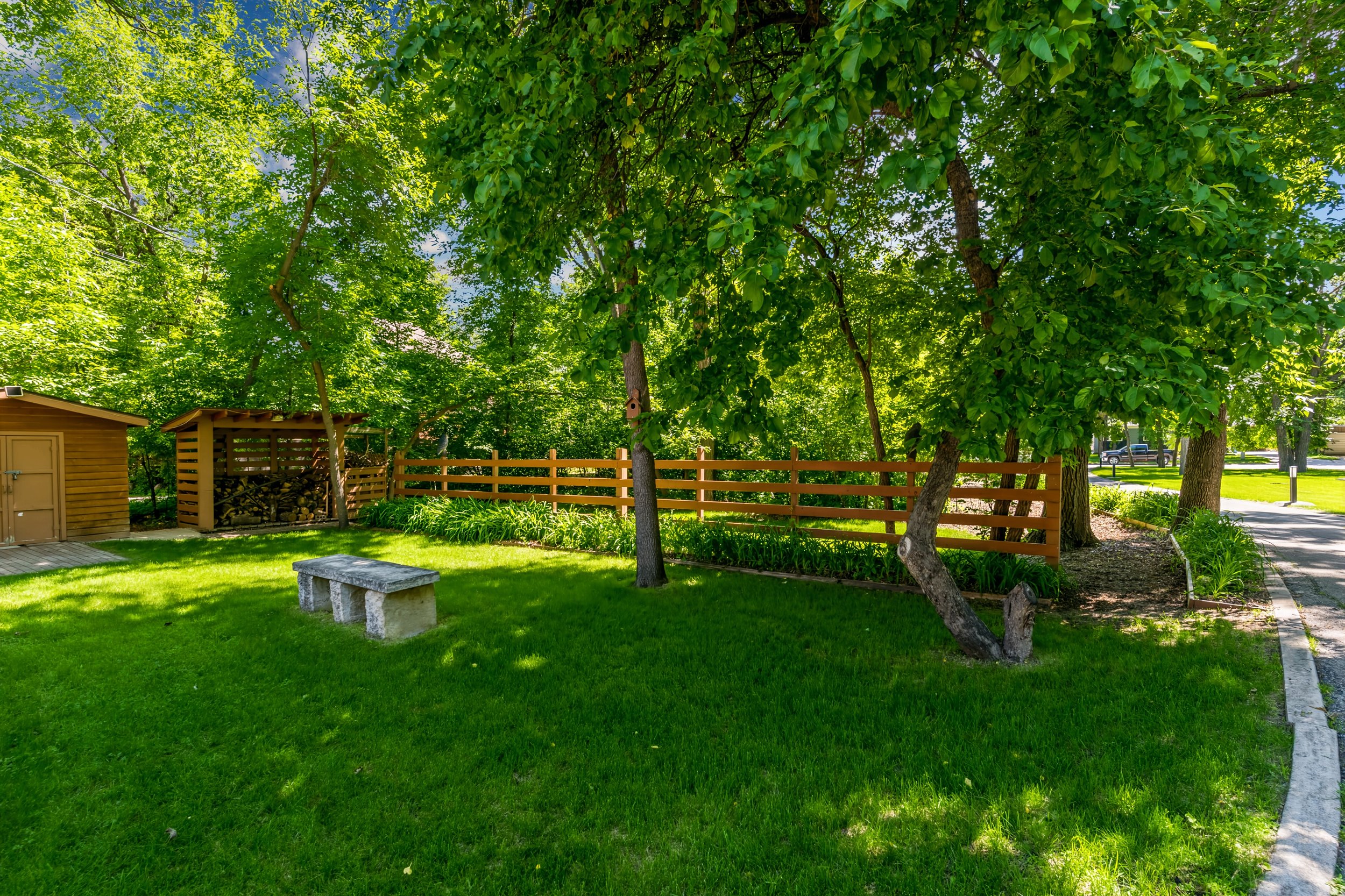 098 Beautiful River Road home surrounded by established landscaping.jpg
