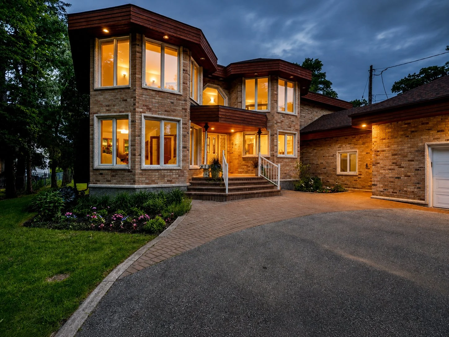 101 Landscaped front entrance of luxury Winnipeg riverfront home.jpg