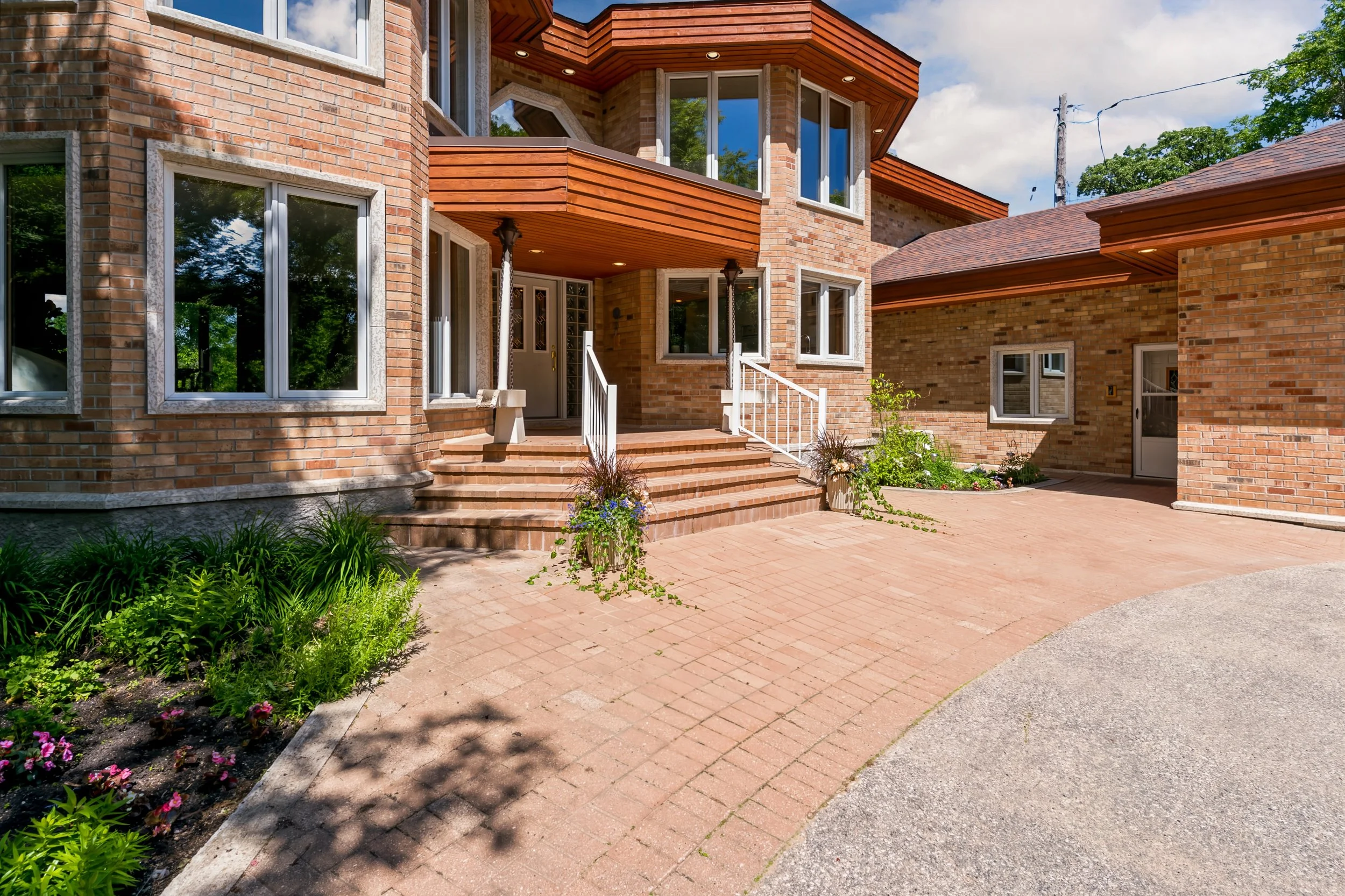 102 Mature perennial beds surrounding custom riverfront home.jpg