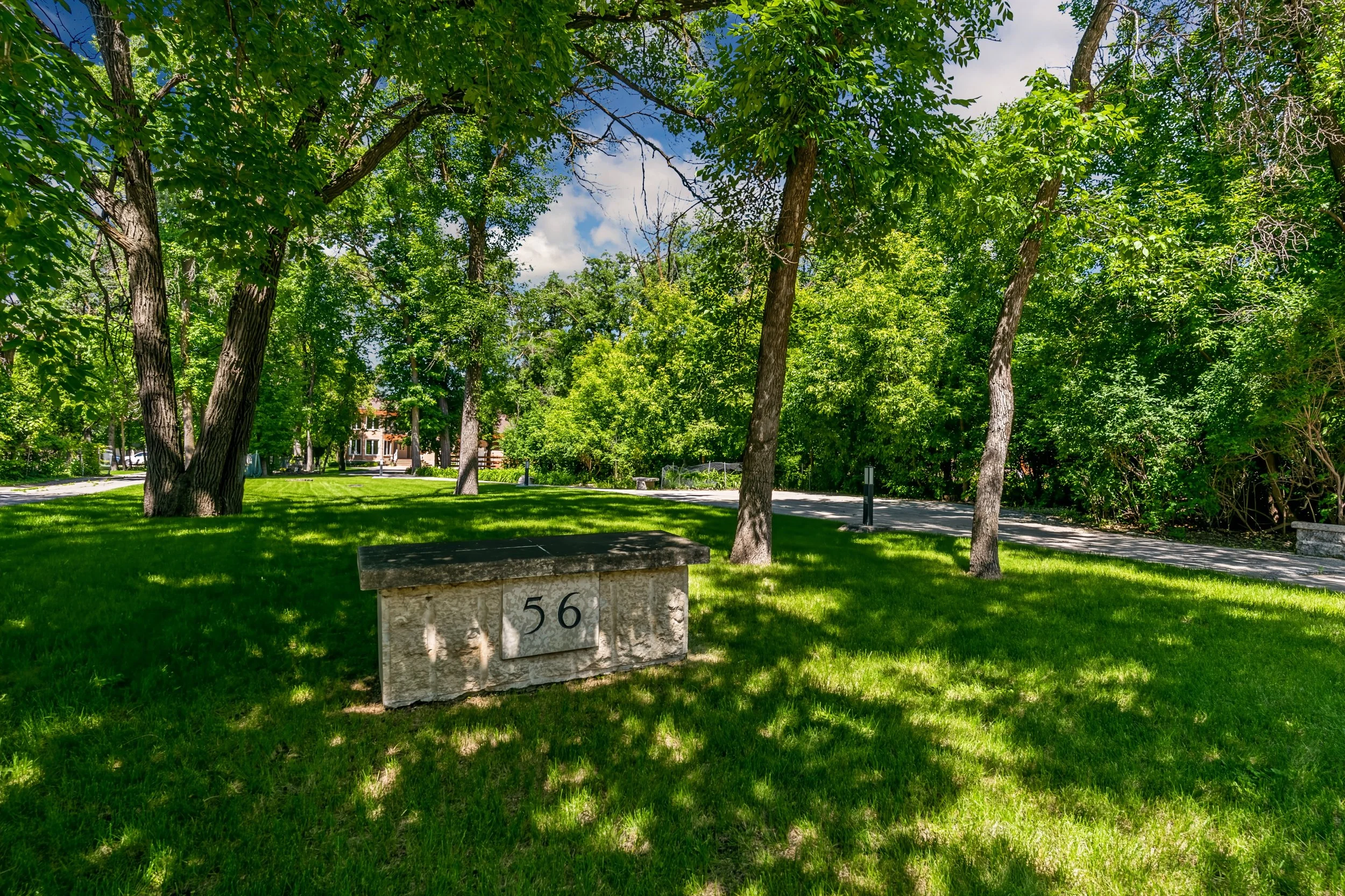 105 Beautifully landscaped front yard at custom River Road property.jpg
