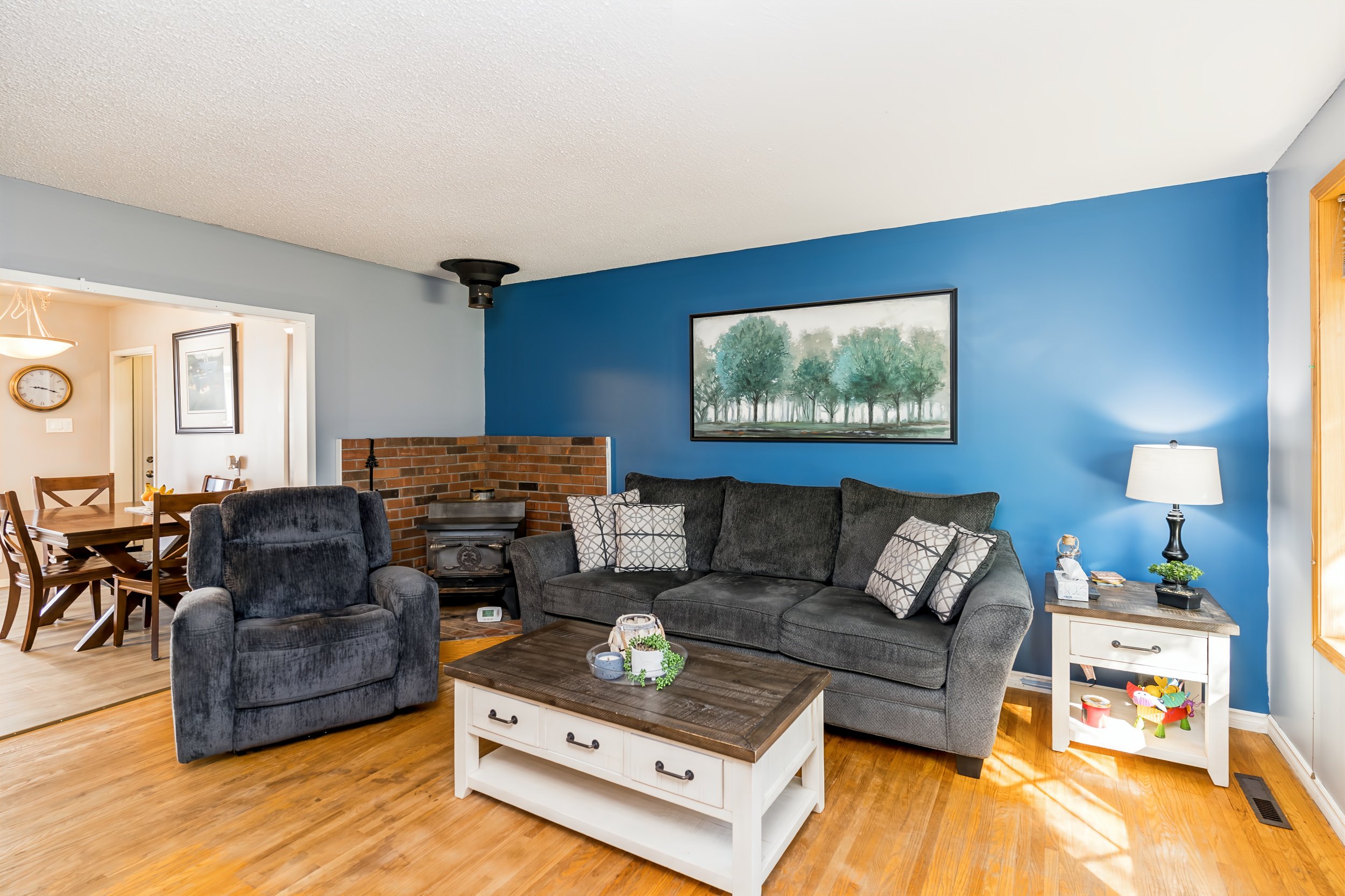 002 Spacious living room with original hardwood floors.jpg
