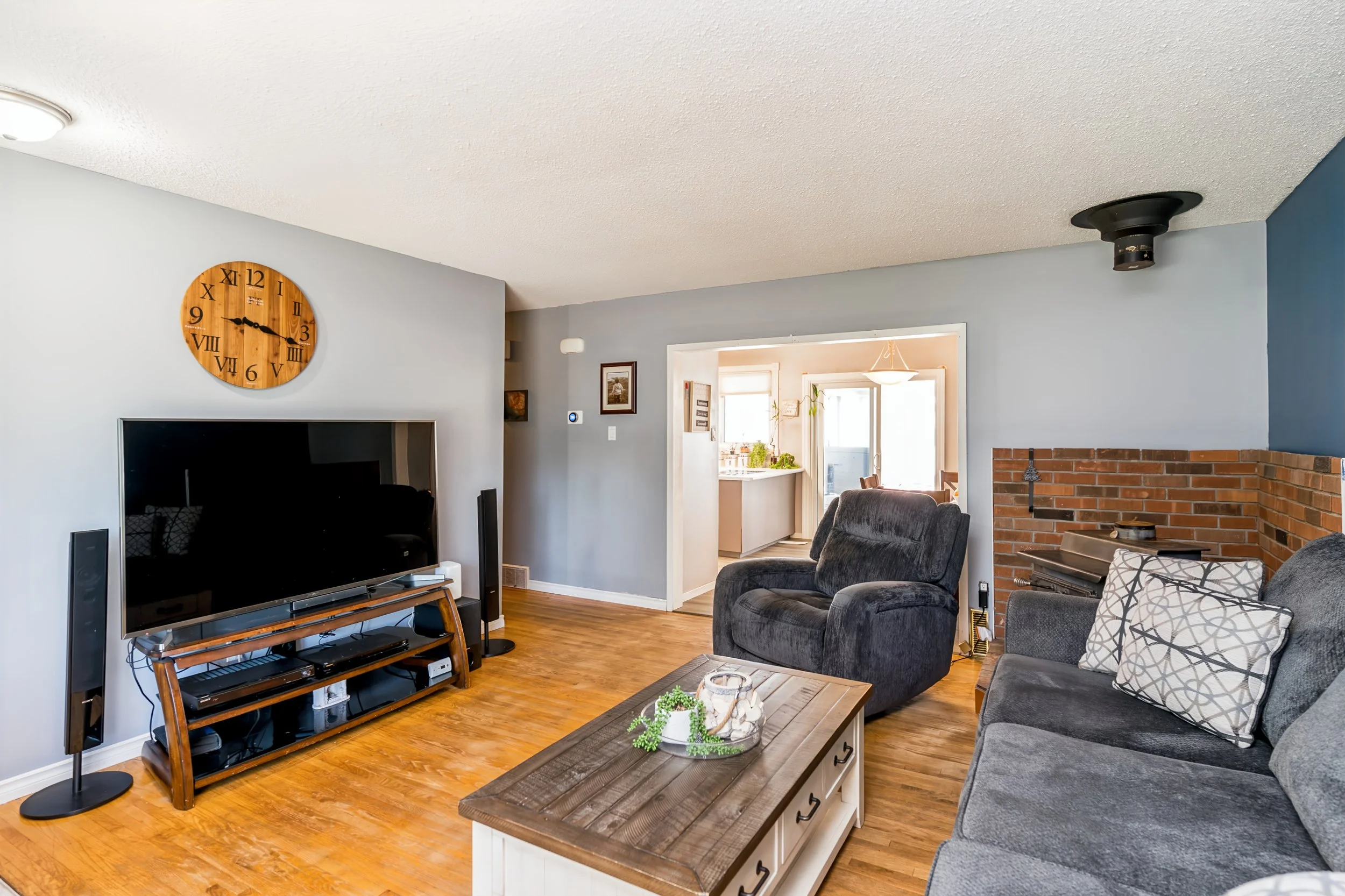 003 Bright main floor living room in Windsor Park bungalow.jpg
