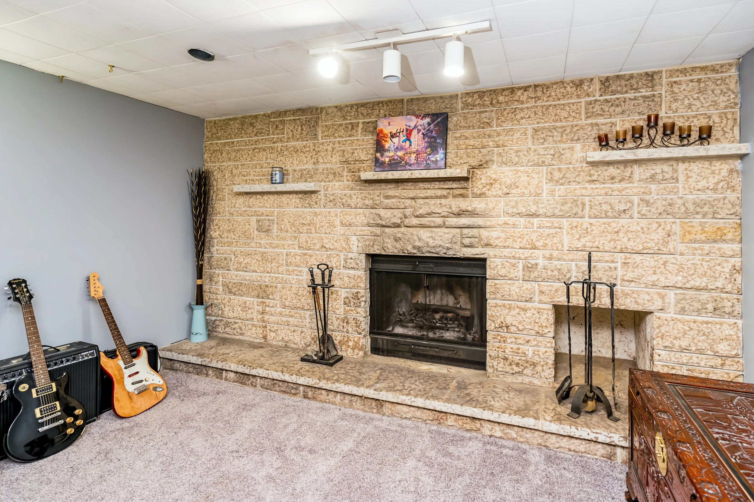 025 Tyndall stone fireplace in finished basement.jpg