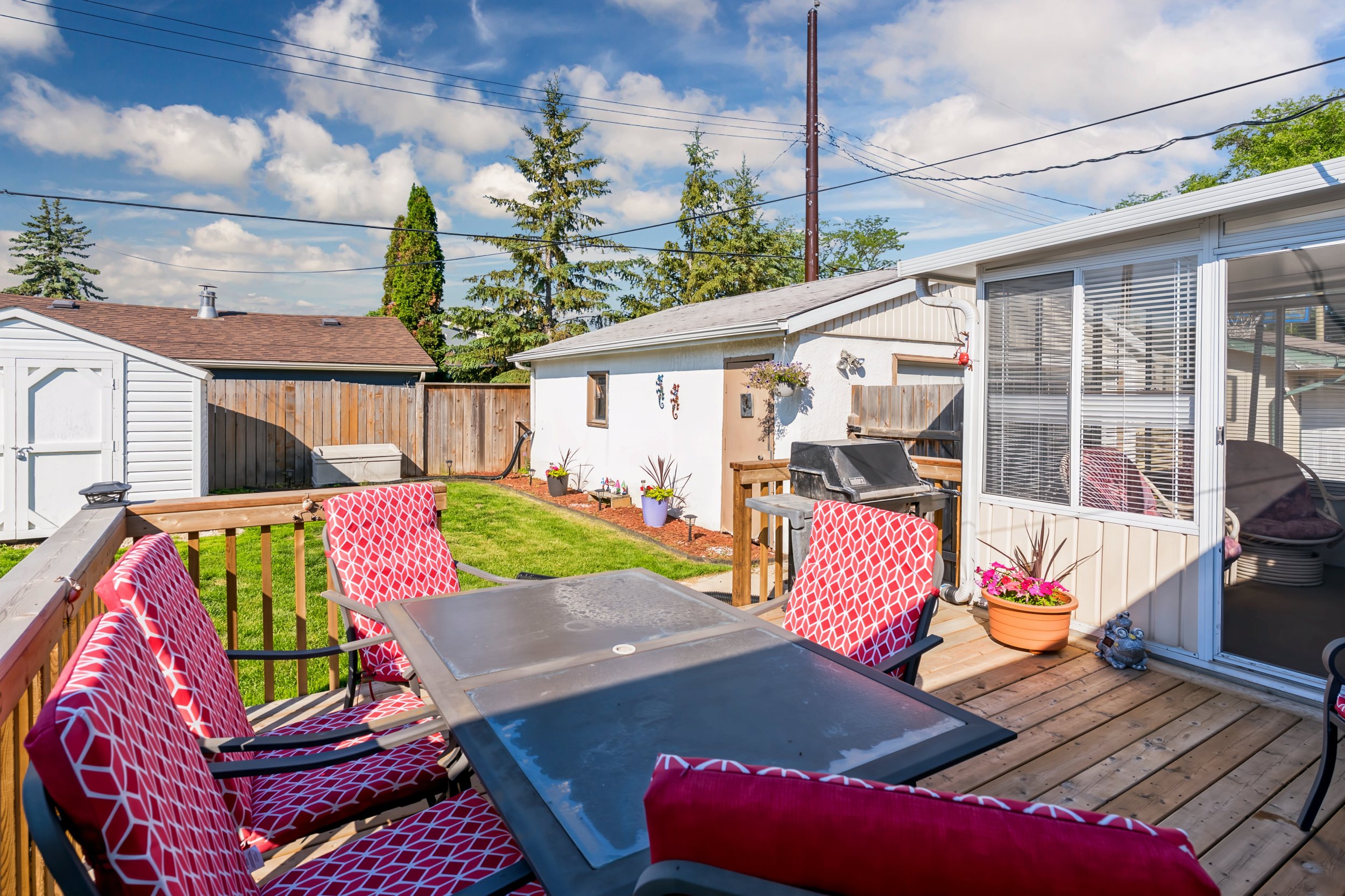 028 Newer deck in fully fenced backyard in Winnipeg.jpg