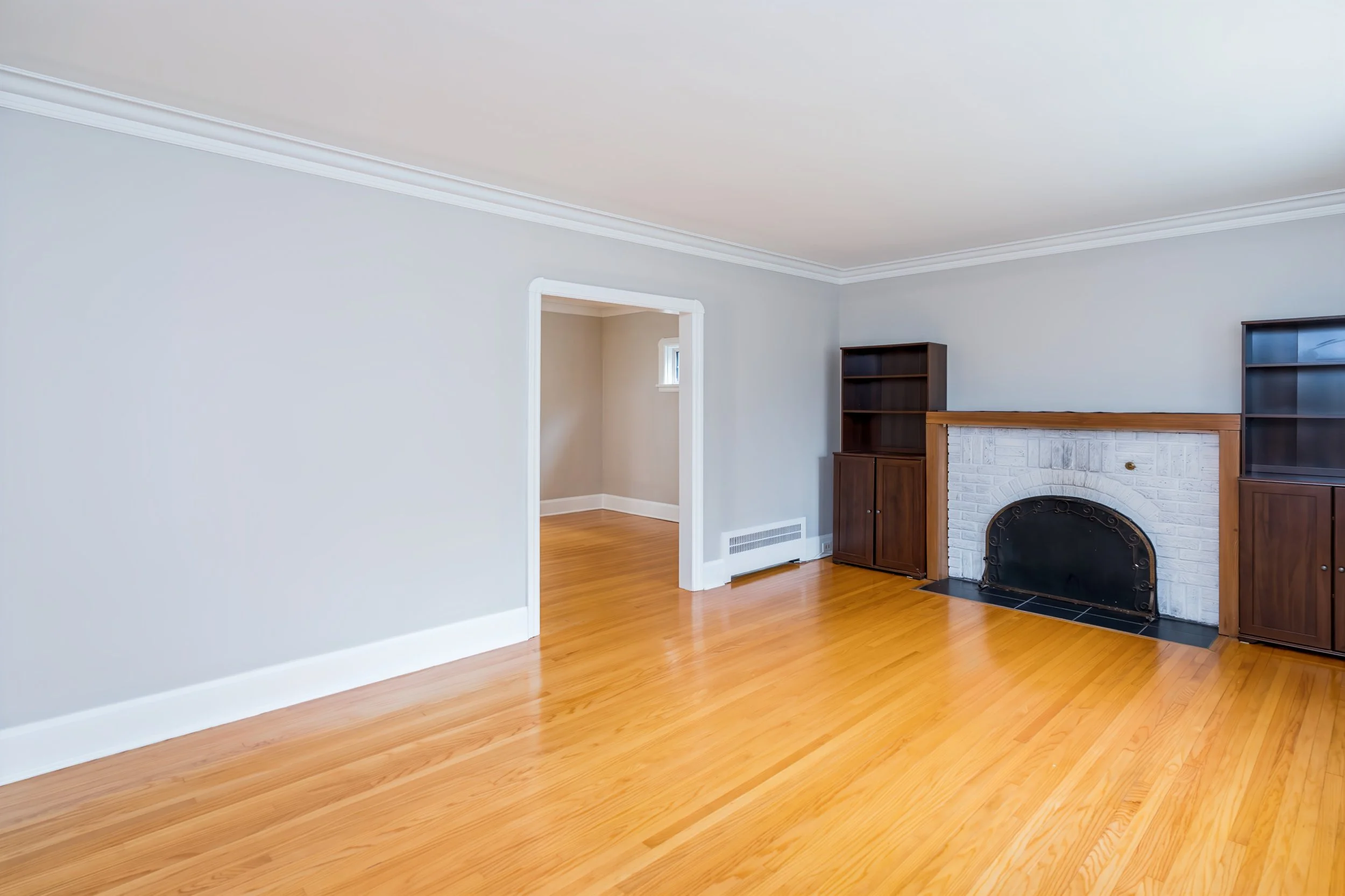 003 Spacious living room with original hardwood floors.jpg