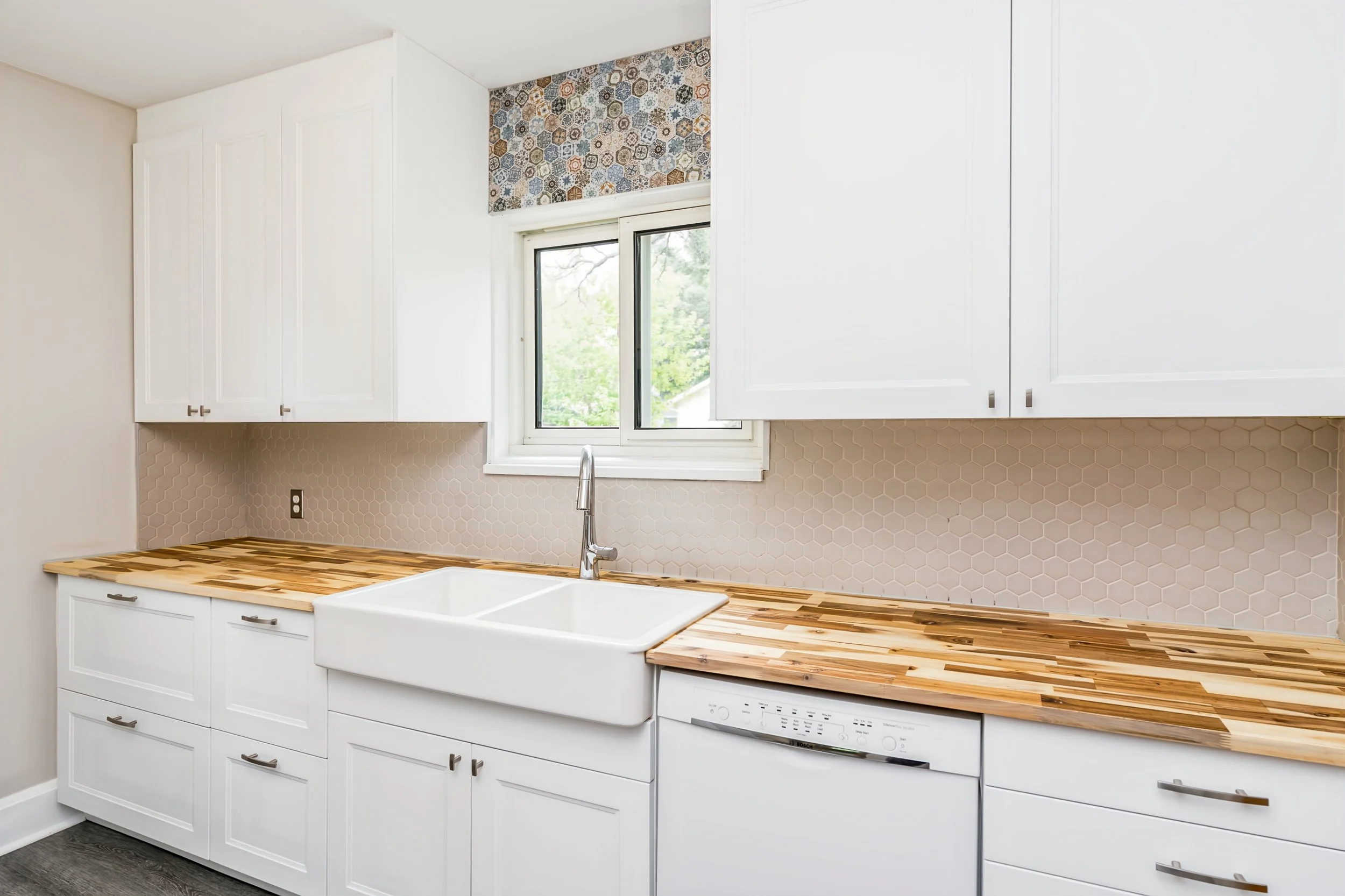 019 Kitchen with butcher-block countertops and farmhouse sink.jpg