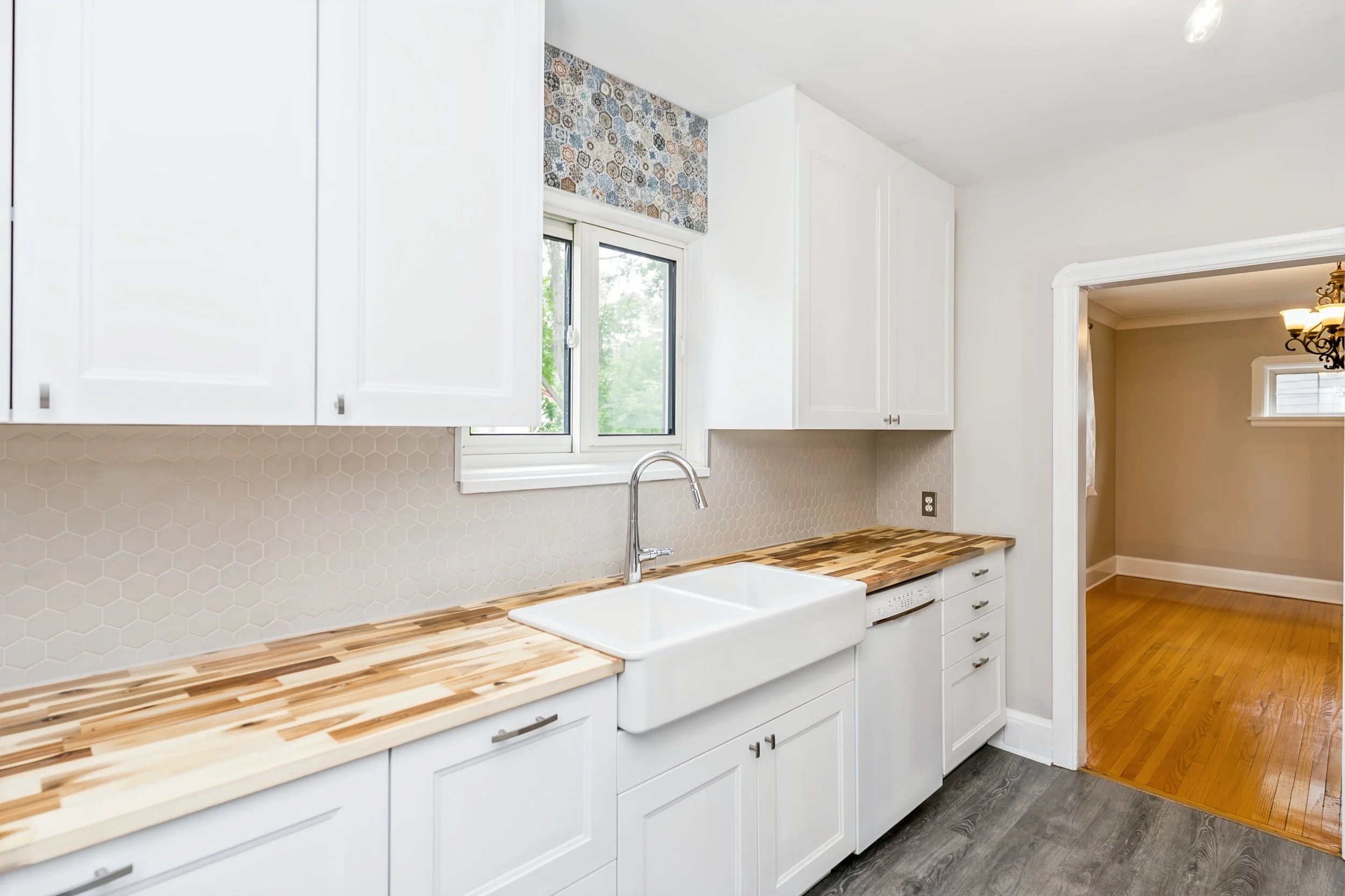 020 Renovated kitchen with custom tile backsplash.jpg