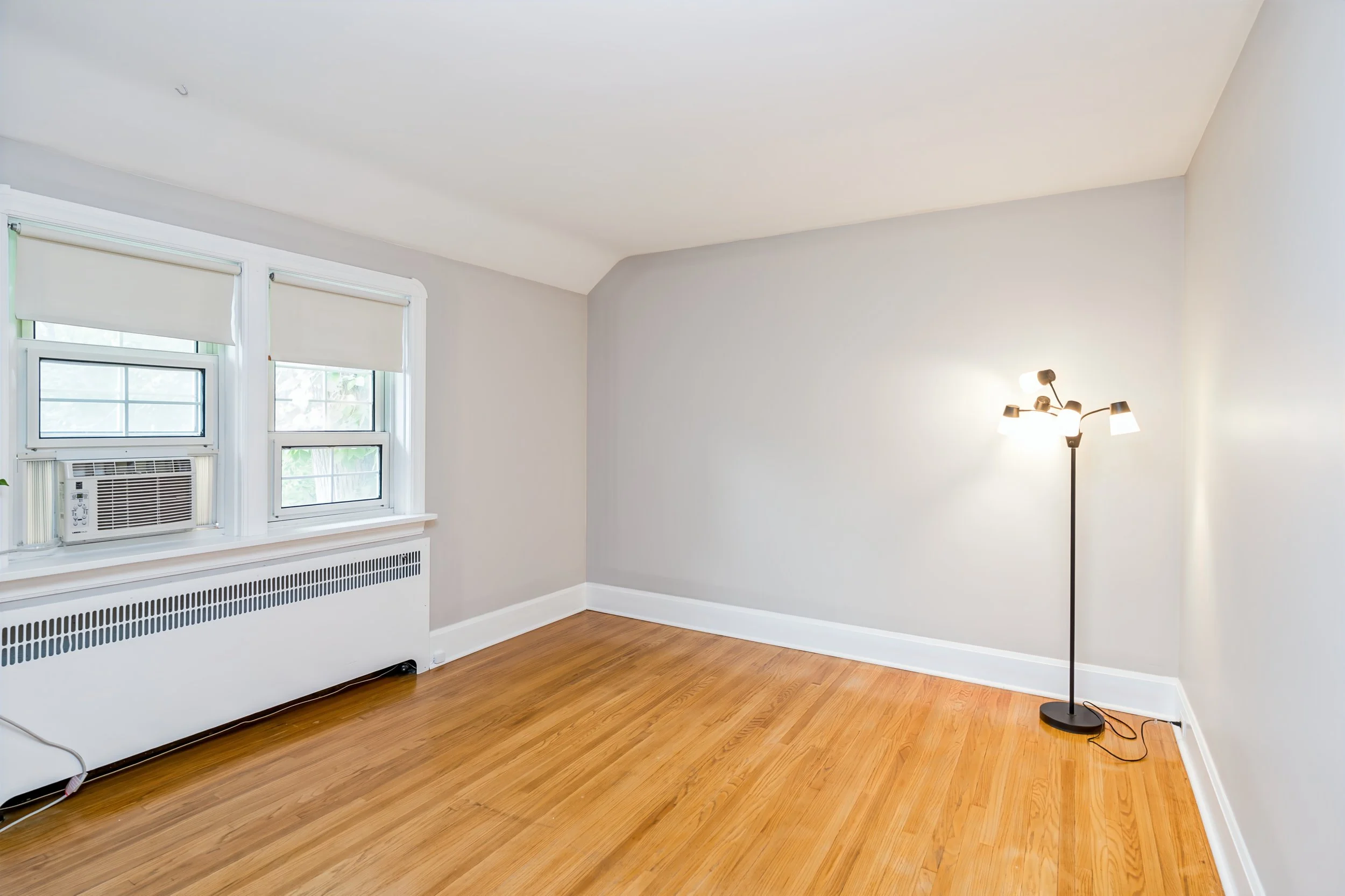 039 Large bedroom with natural light and character charm.jpg