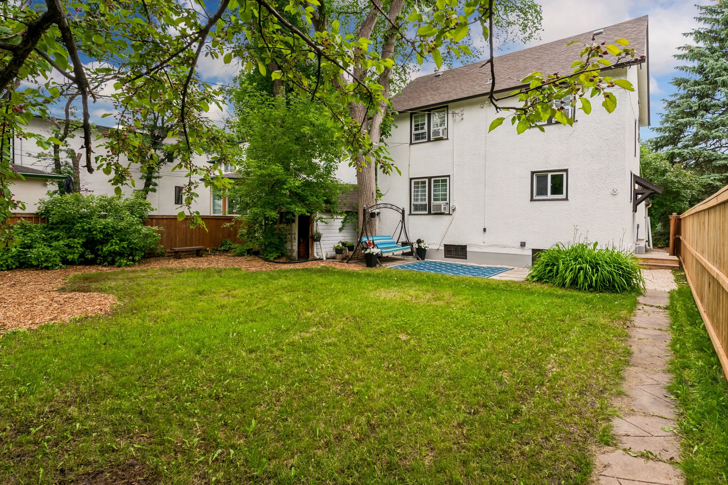 054 Large fenced backyard with mature trees.jpg
