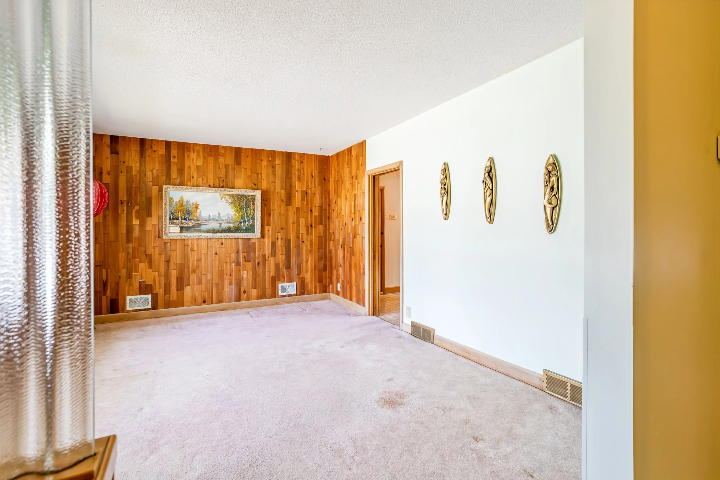 003 Spacious main-floor living room in East Fort Garry home.jpg