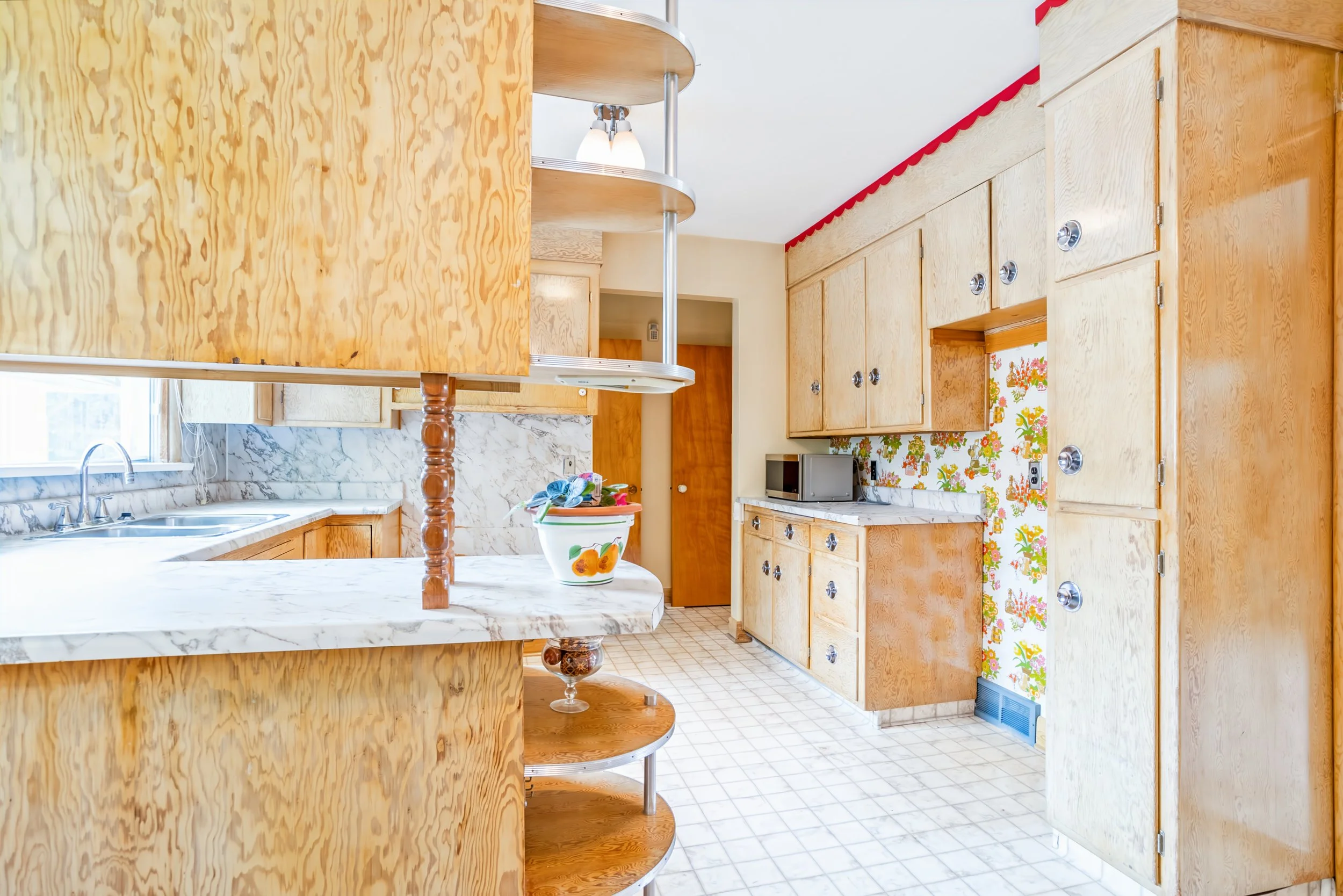 014 Functional kitchen layout in East Fort Garry bungalow.jpg