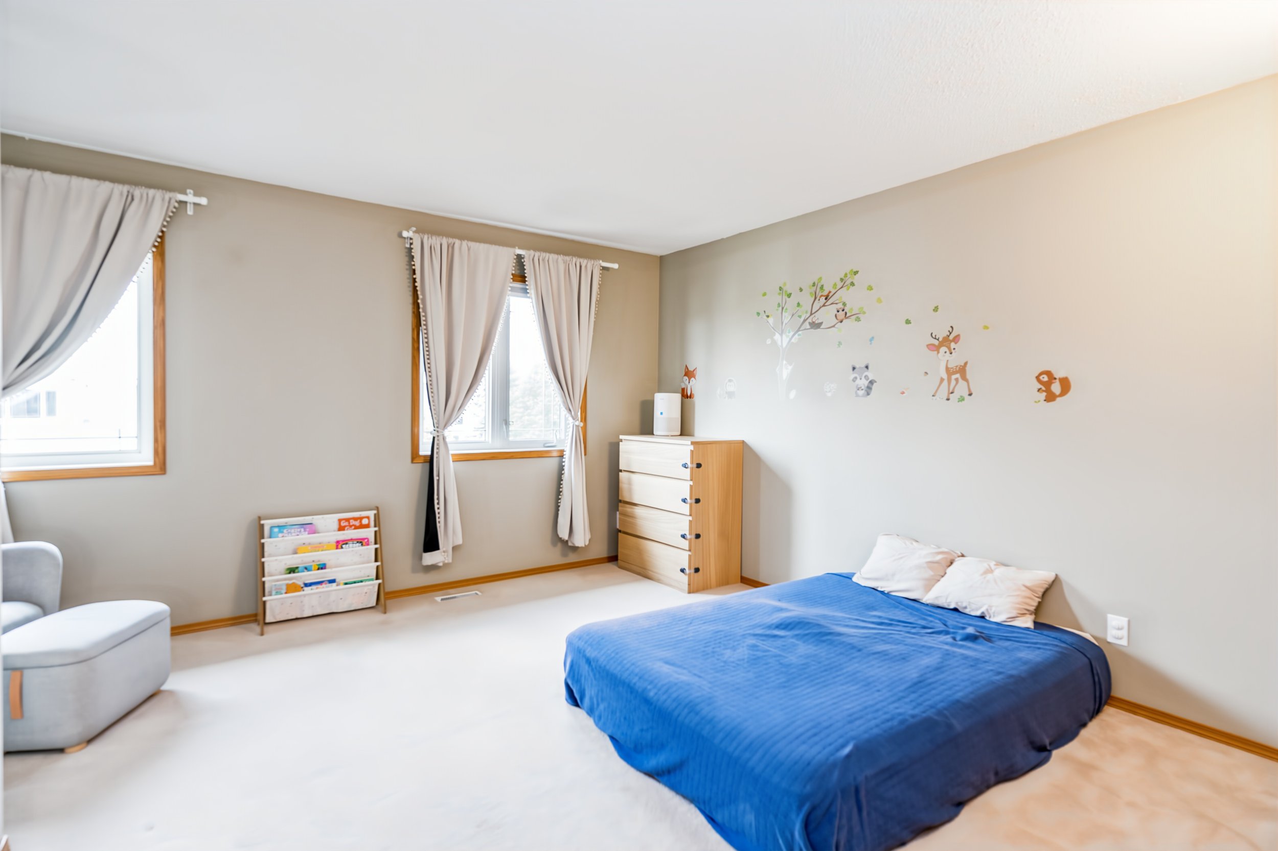 032 Bright secondary bedroom with generous floor space.jpg
