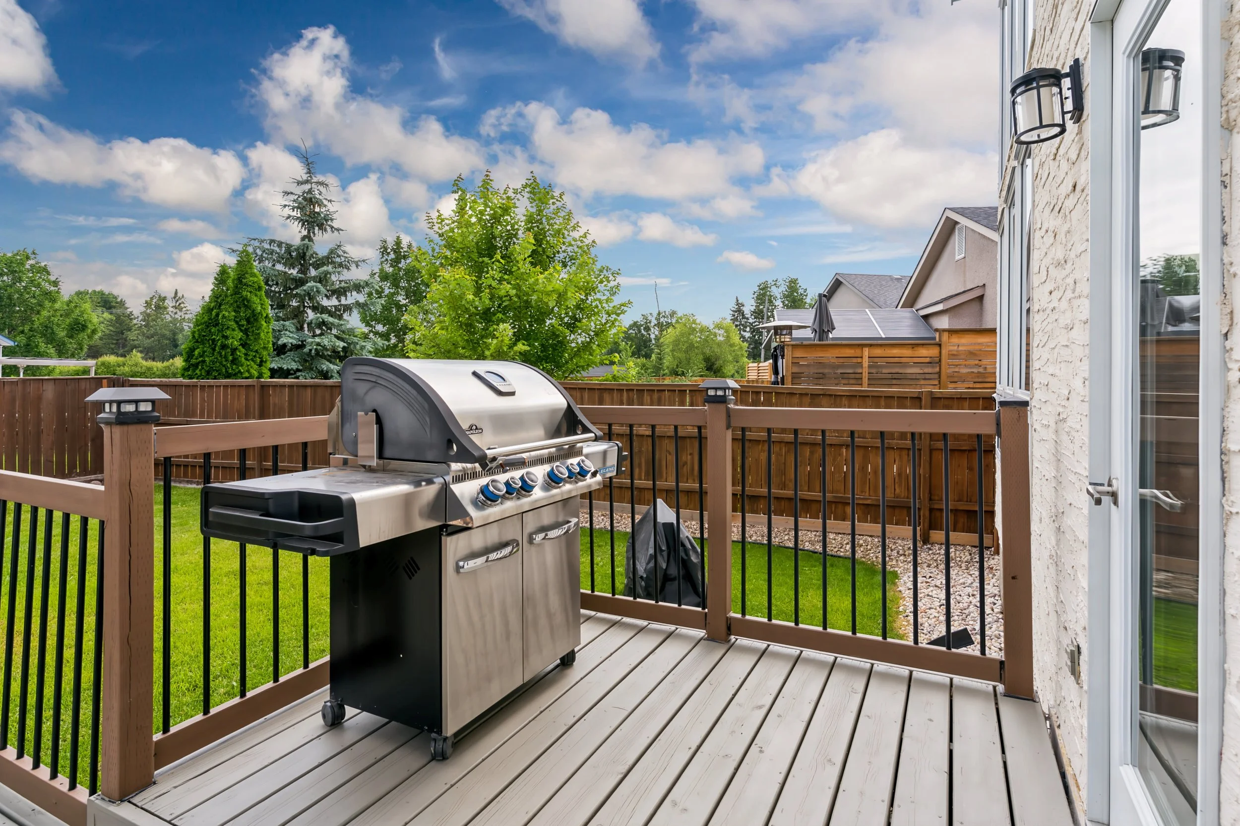 044 Two-tiered backyard deck in Royalwood.jpg