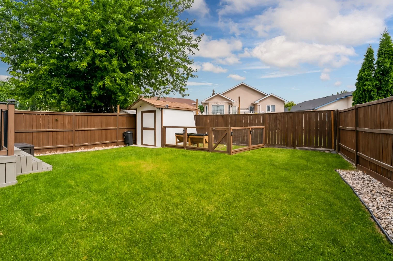 048 Gardens and green space behind Royalwood family home.jpg