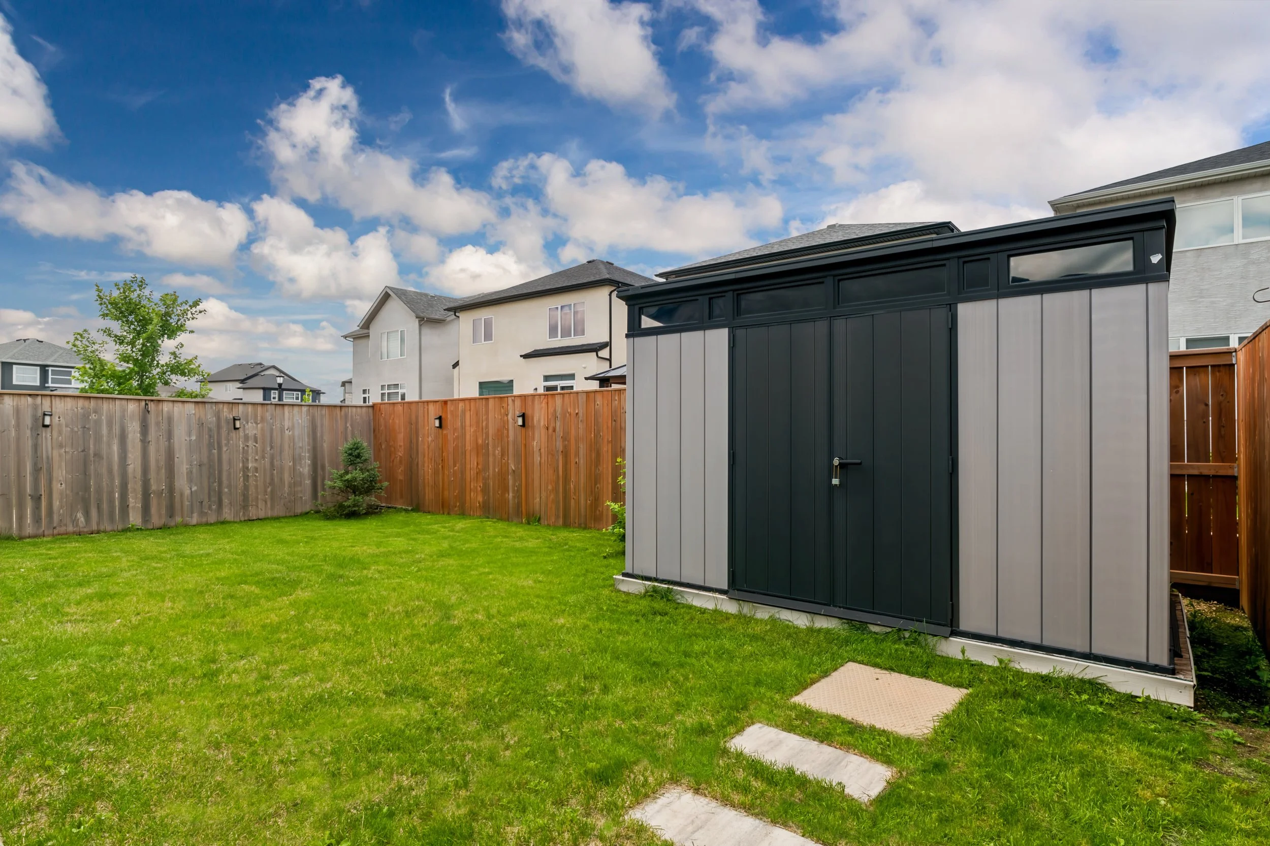 043 Storage shed in landscaped backyard.jpg