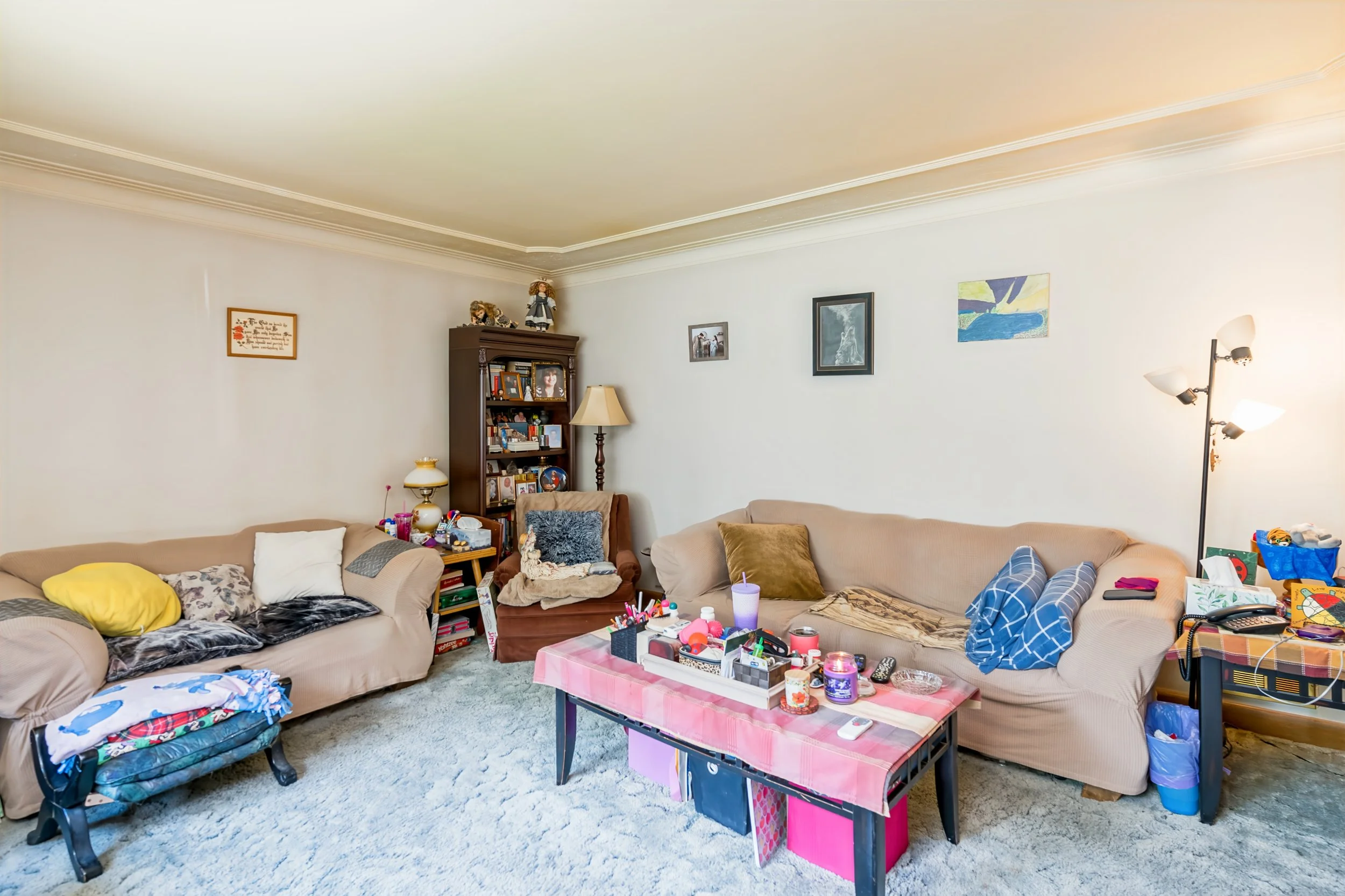 004 Main living room with original hardwood floors awaiting restoration.jpg