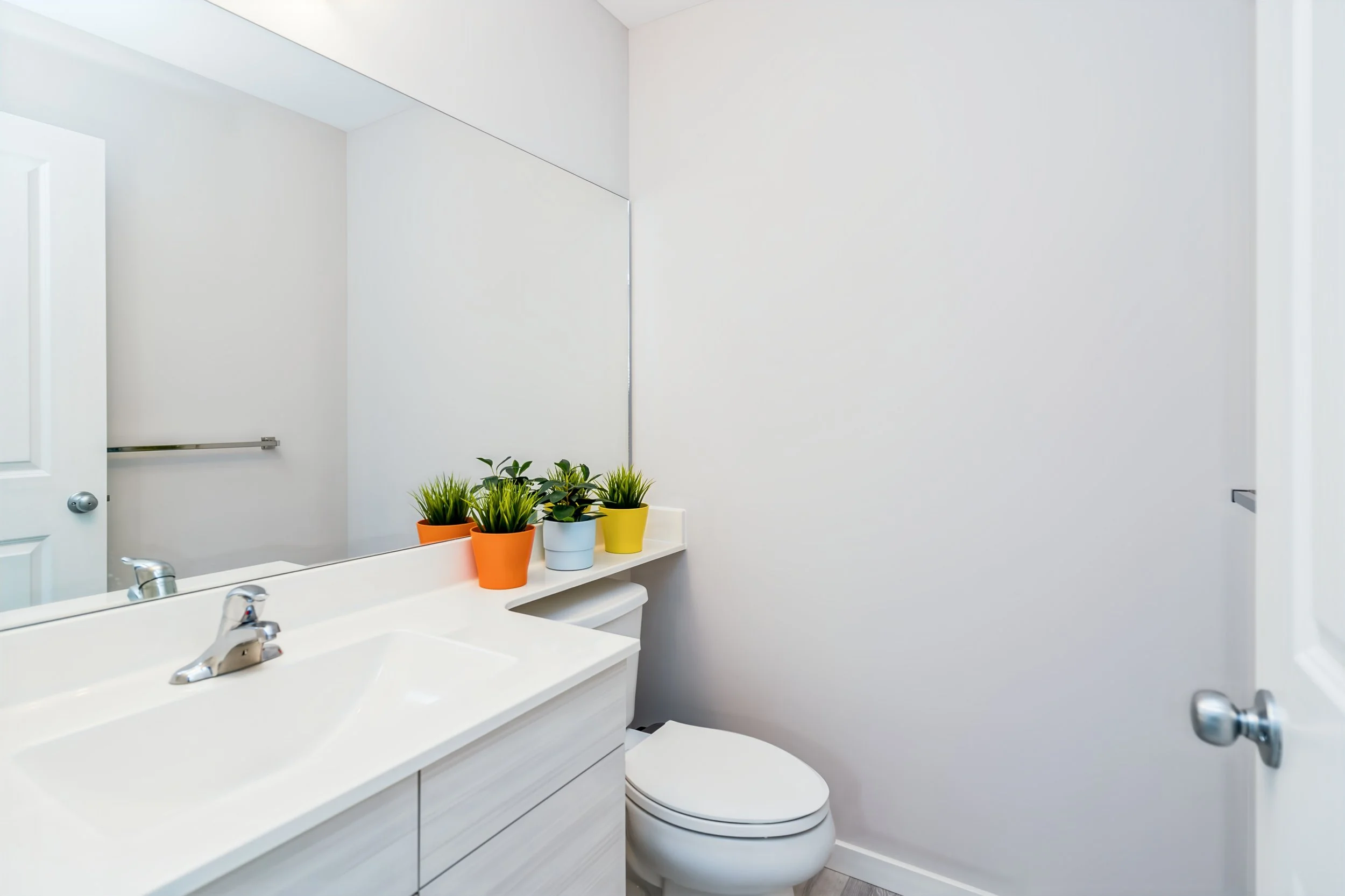 025 convenient powder room in bonavista show home.jpg