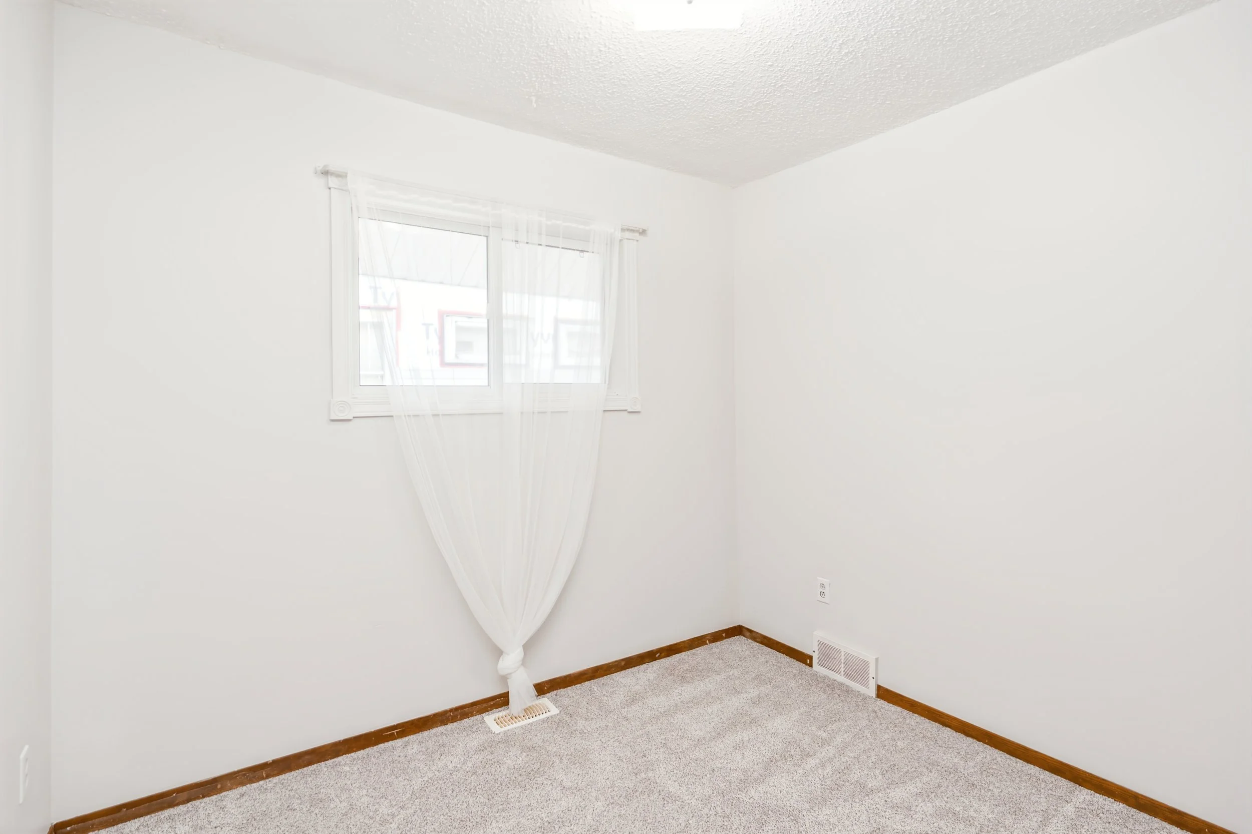 021 Second main-floor bedroom in three-bedroom bungalow.jpg