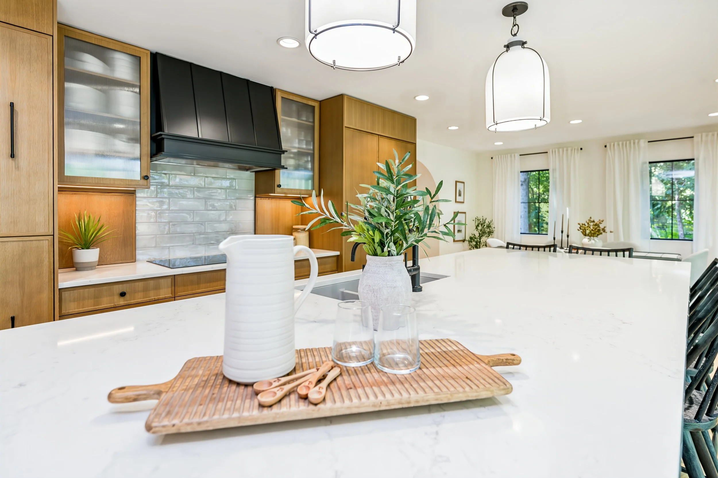 027 Renovated kitchen with oversized island at 409 North Drive.jpg