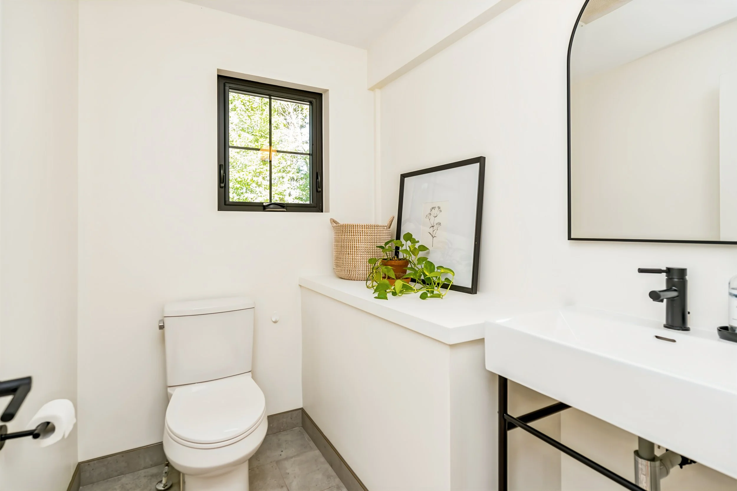 043 main floor powder room in riverfront home.jpg