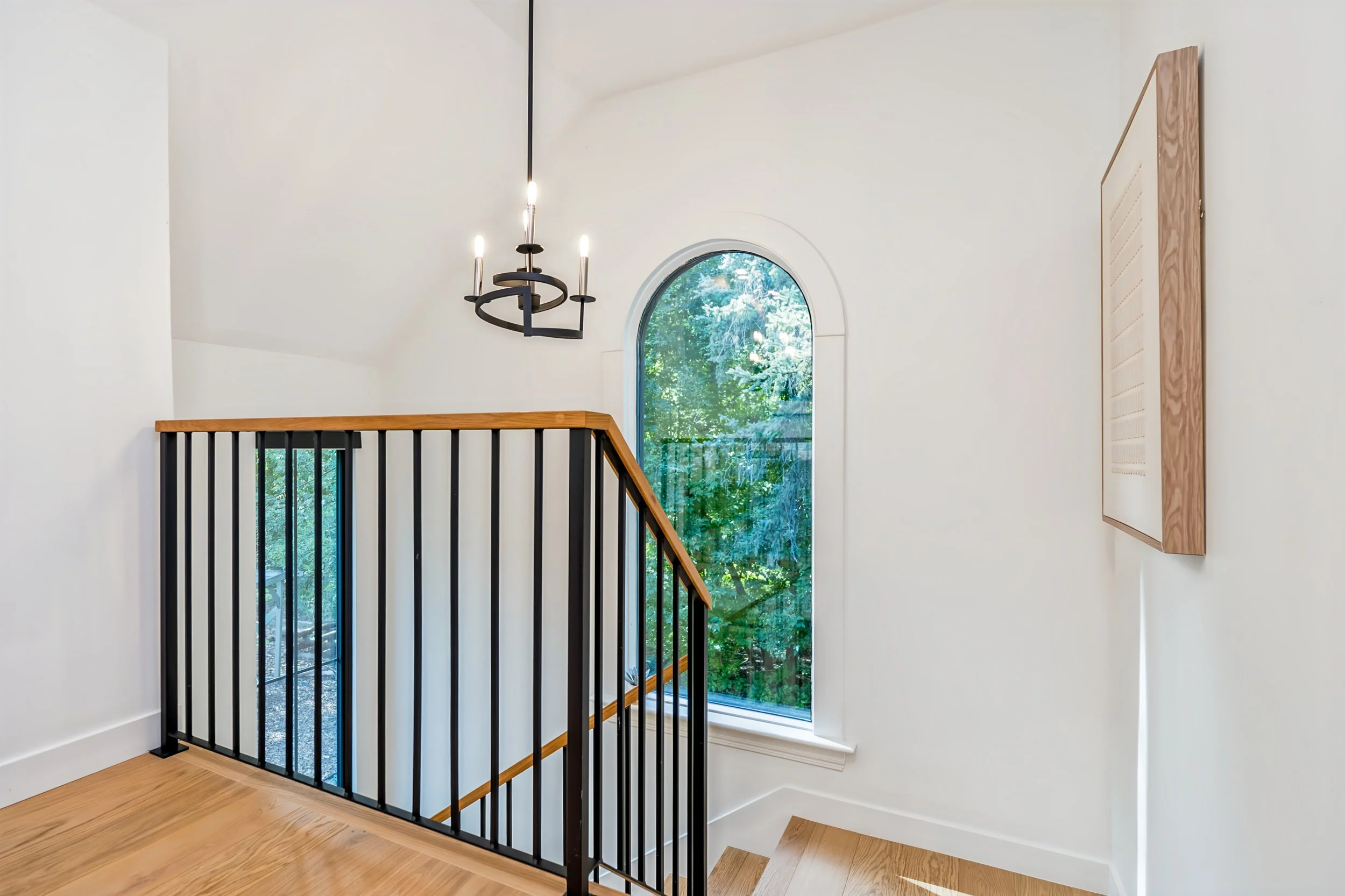 045 custom staircase with arched windows winnipeg.jpg