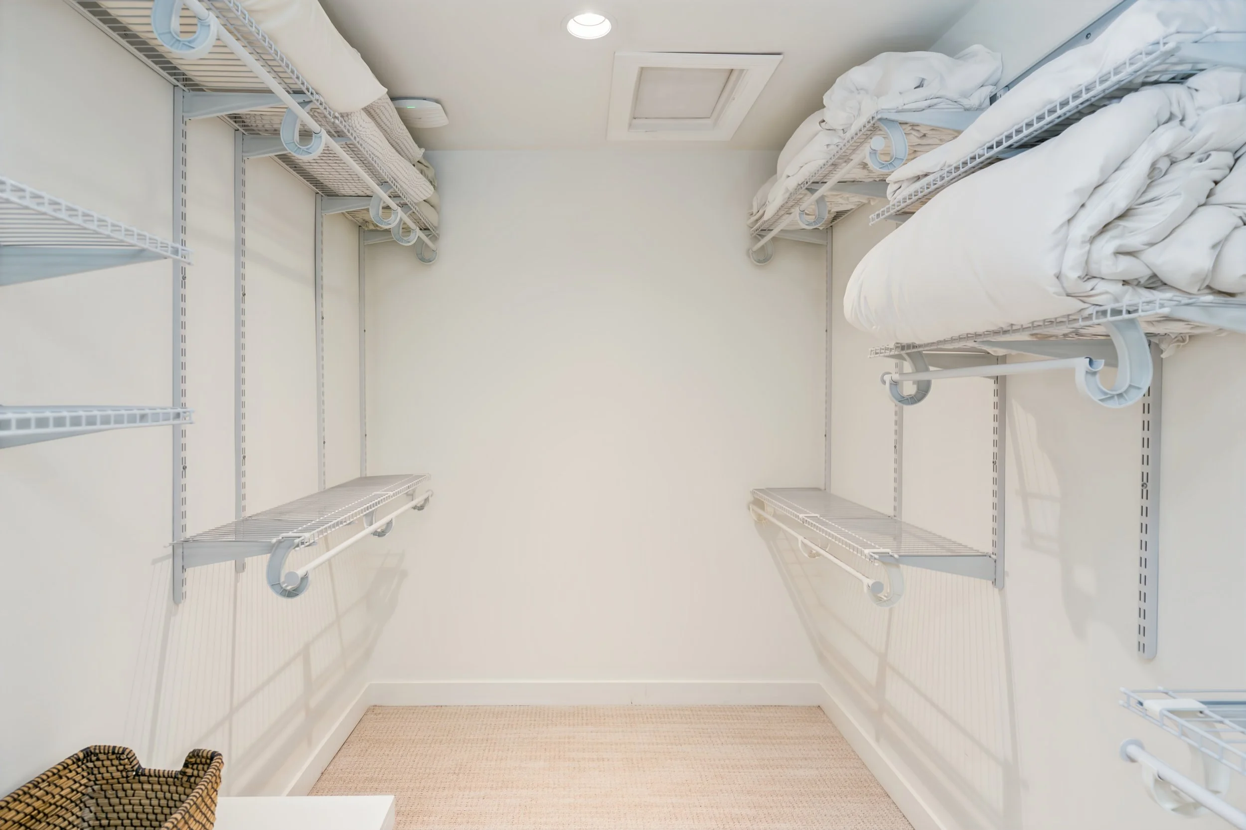 059 Walk-in closet in riverfront primary suite.jpg