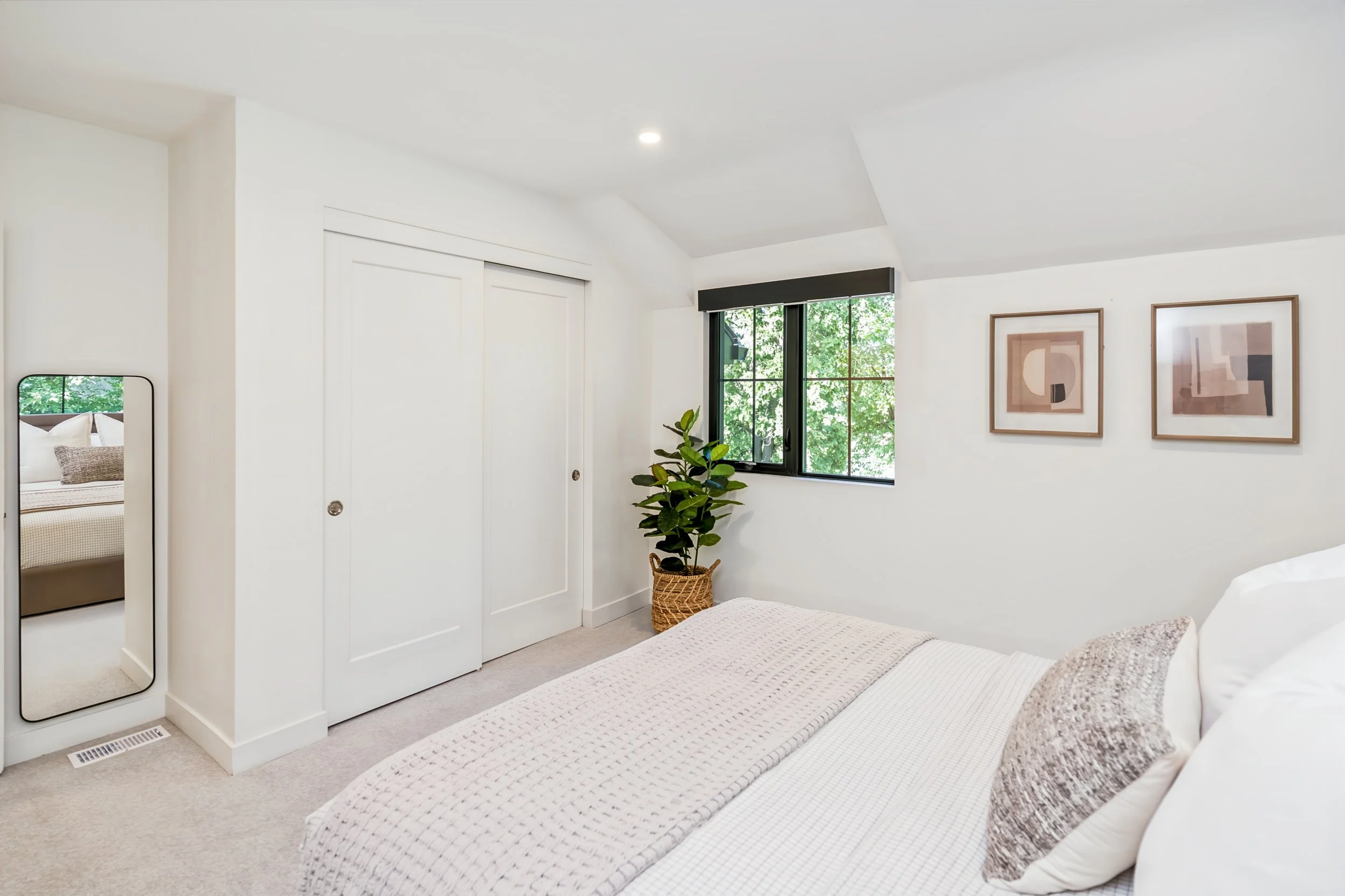 062 Renovated upstairs bedroom with riverfront views winnipeg.jpg