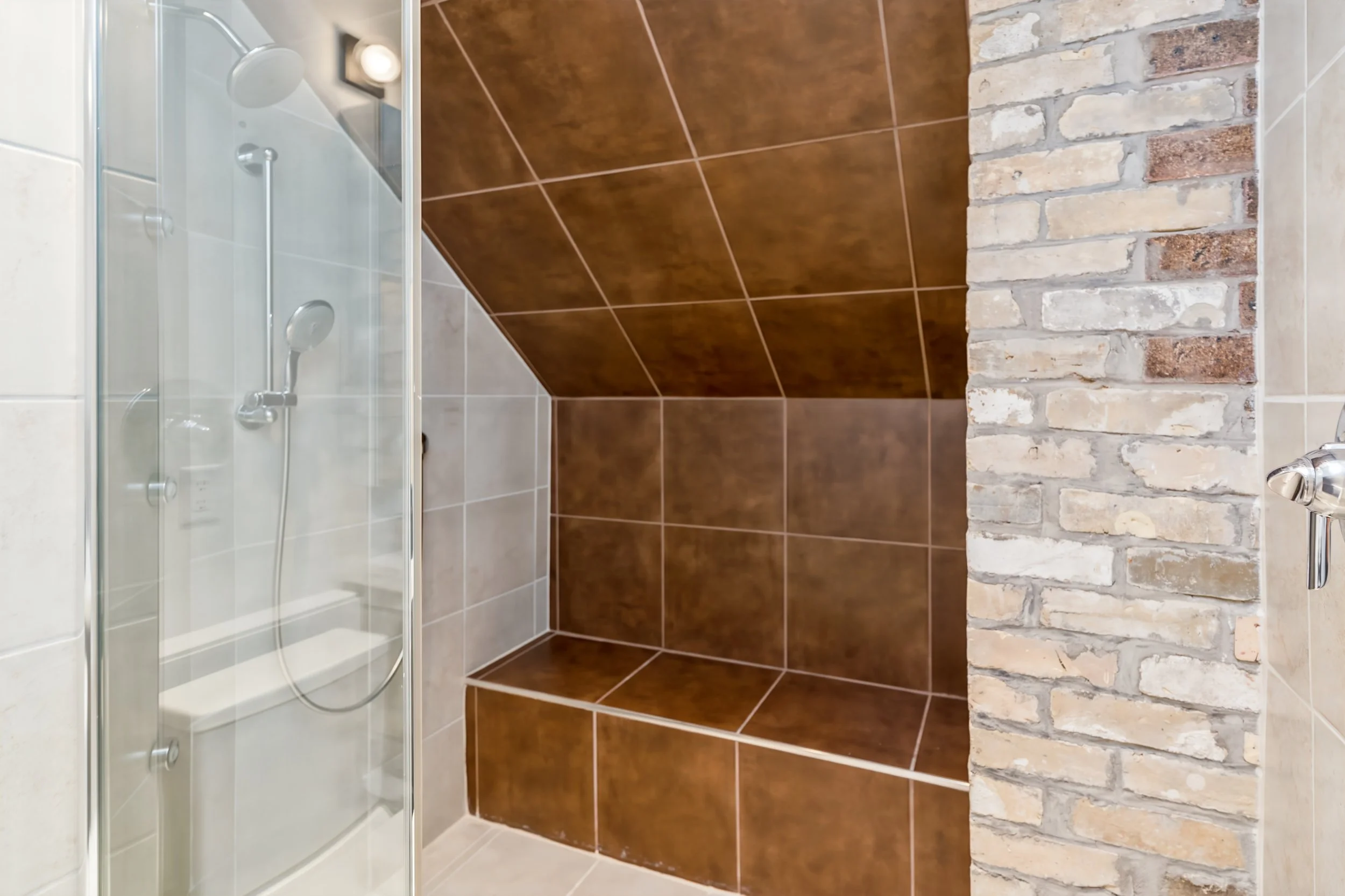 067 luxury bathrooms with custom brick detail.jpg