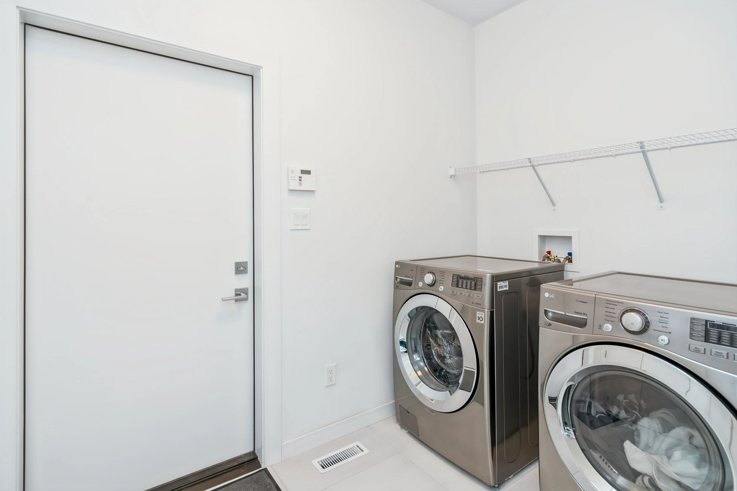 029 Main-floor laundry in Artista bungalow.jpg