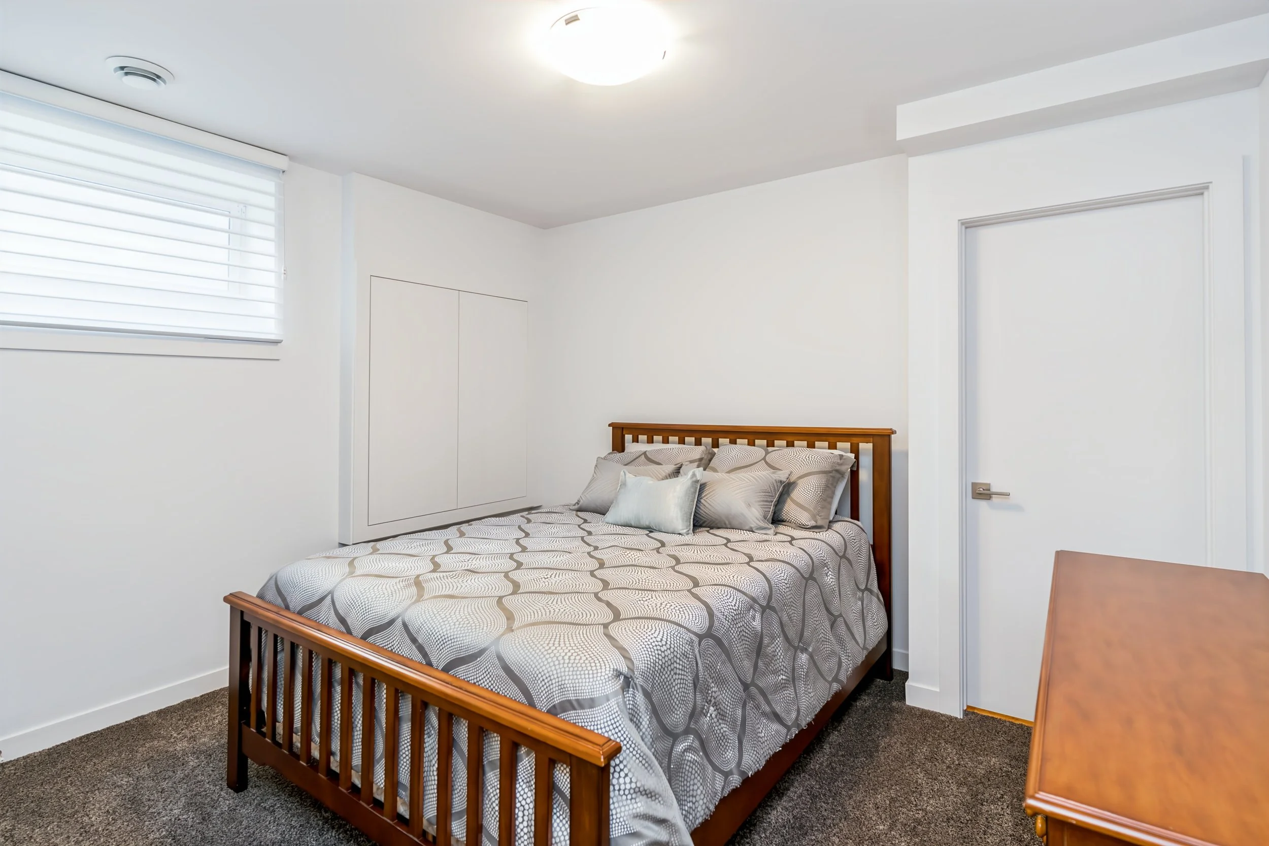 044 Fourth bedroom with egress window in Winnipeg bungalow.jpg