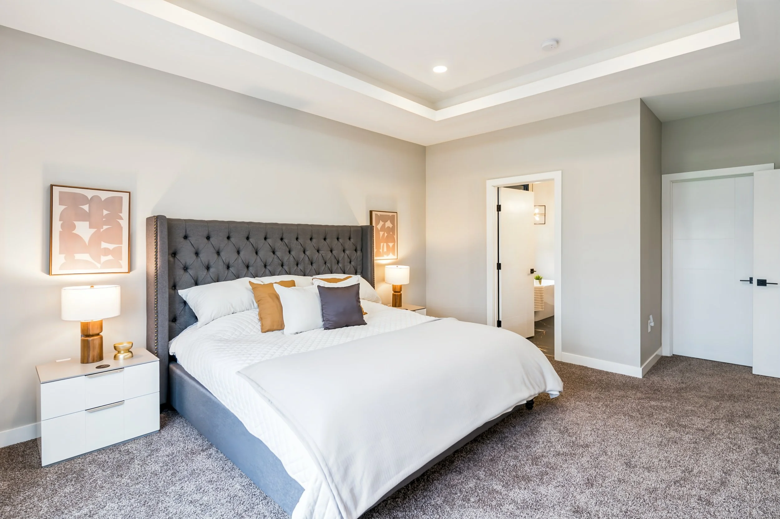 035 Primary bedroom with access to its private ensuite bathroom..jpg