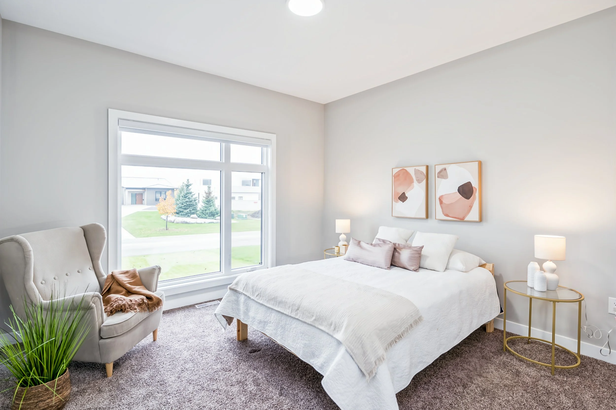 041 Second main-floor bedroom with a private ensuite..jpg
