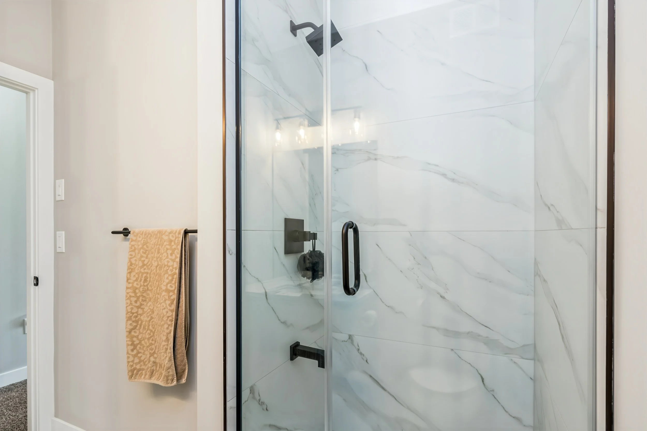 043 Private ensuite serving the second main-floor bedroom.jpg
