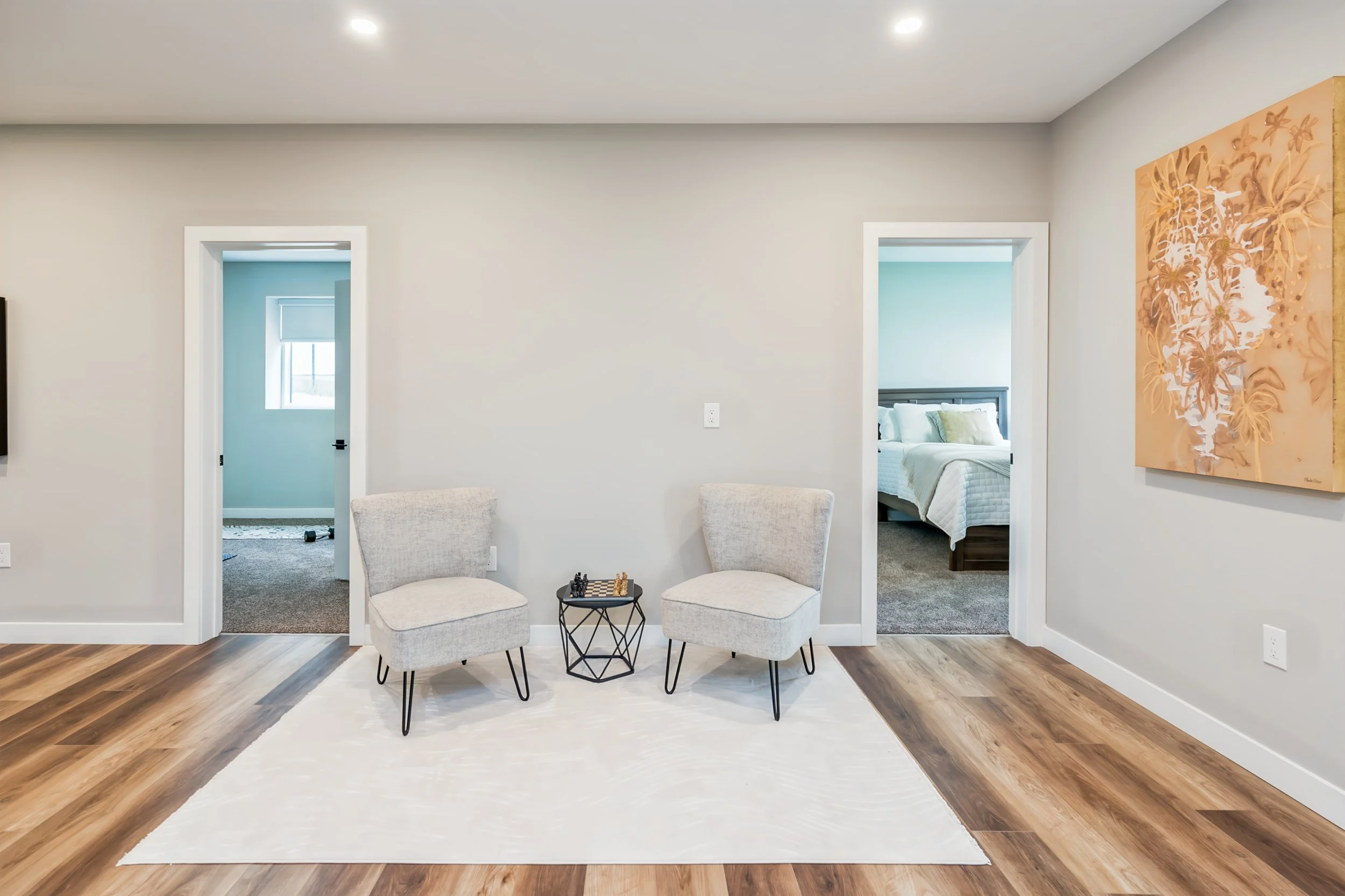 054 Finished basement with 9-foot ceilings and multiple gathering areas..jpg