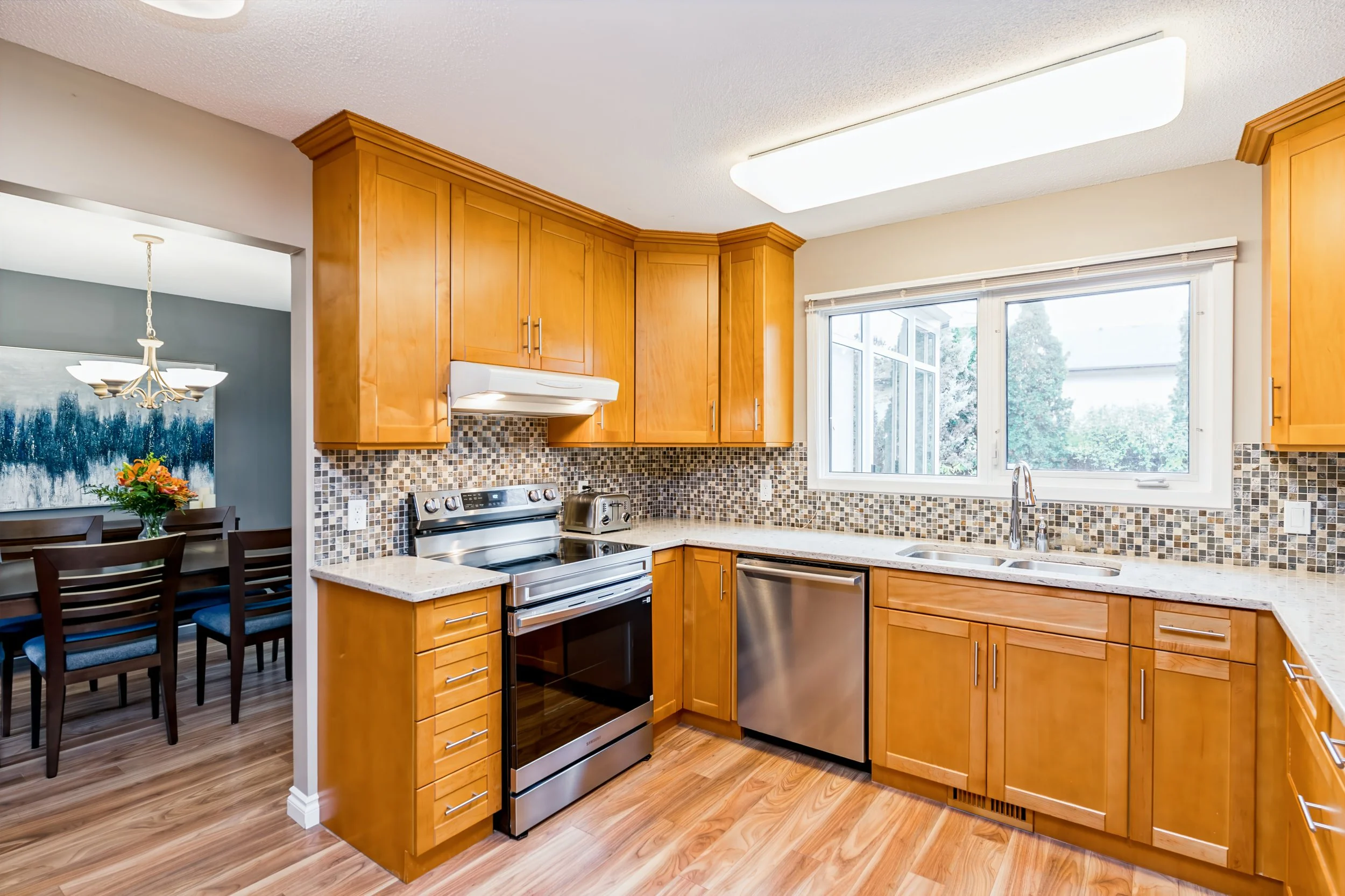 004 Updated kitchen with maple cabinetry and quartz countertops..jpg