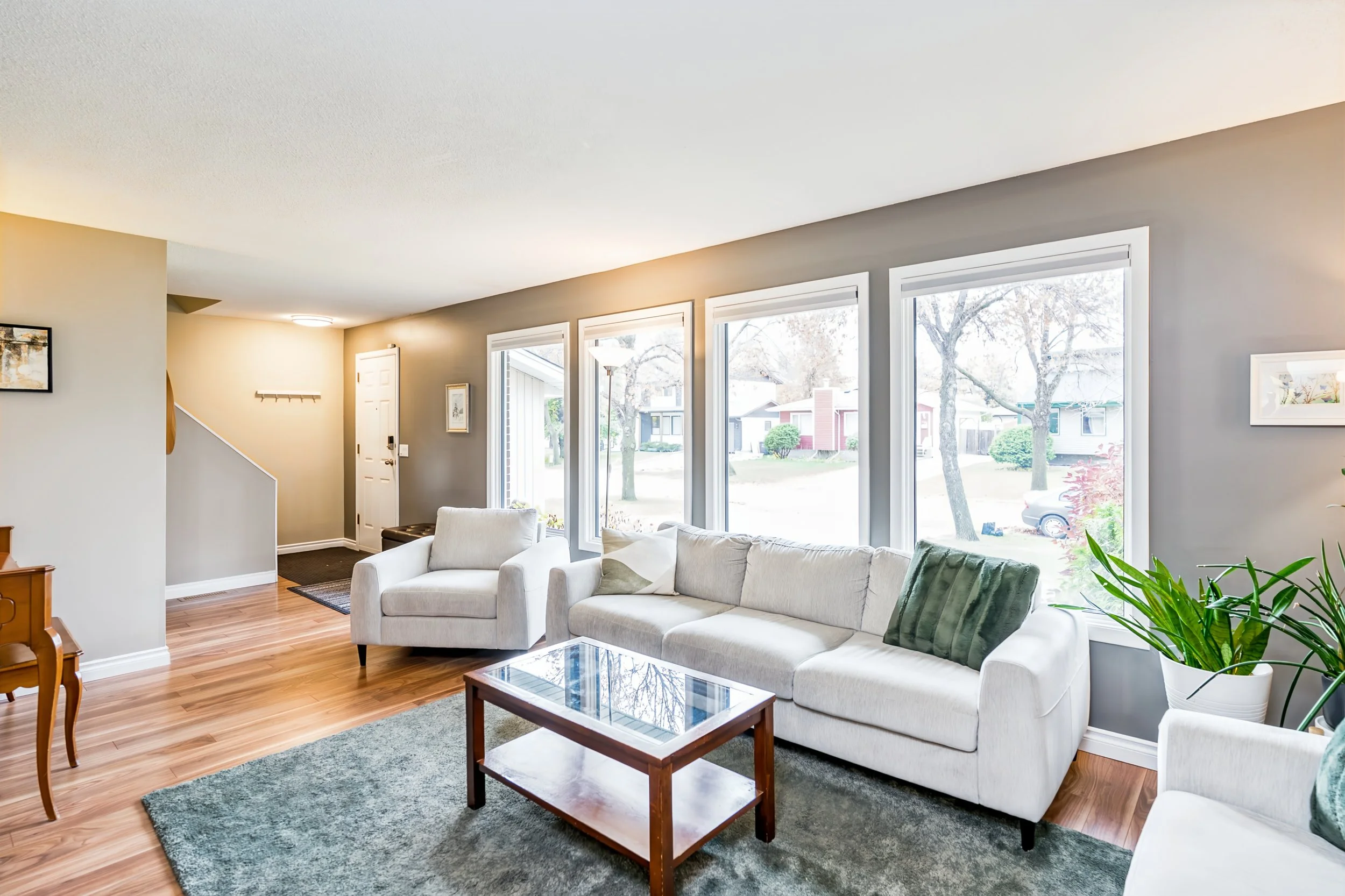 013 Main-floor living room with laminate flooring..jpg