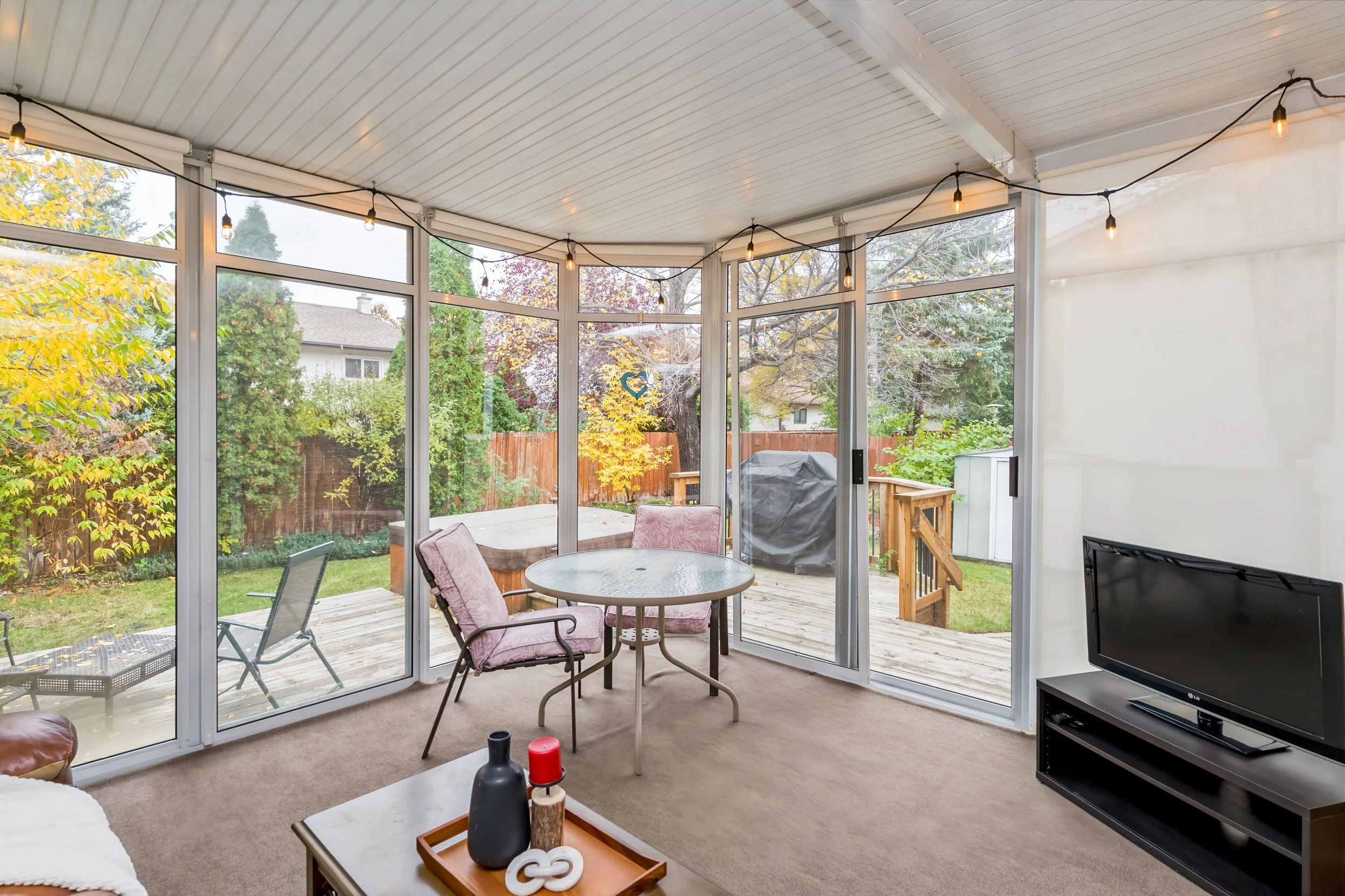 018 Three-season sunroom accessed from the dining room..jpg