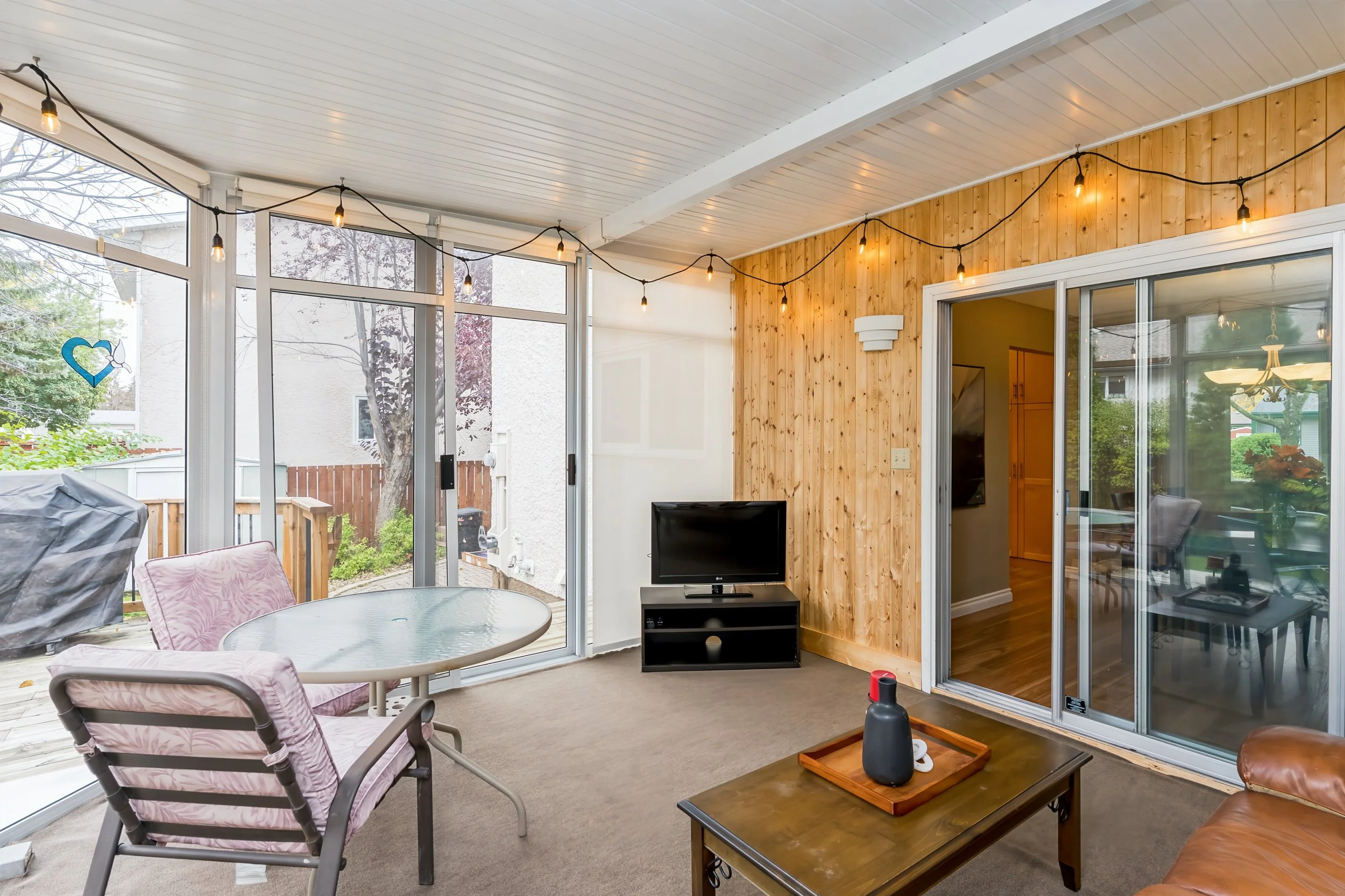 020 Three-season sunroom with access to the rear deck..jpg