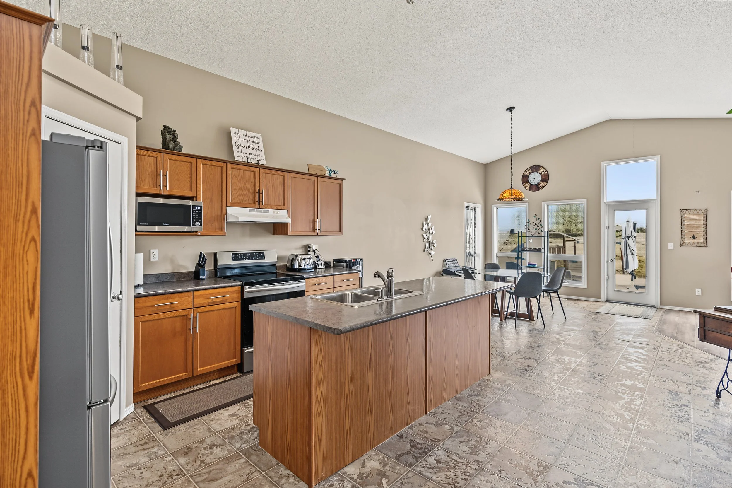002 Kitchen with shaker-style cabinetry at 99 Nevens Bay..jpeg