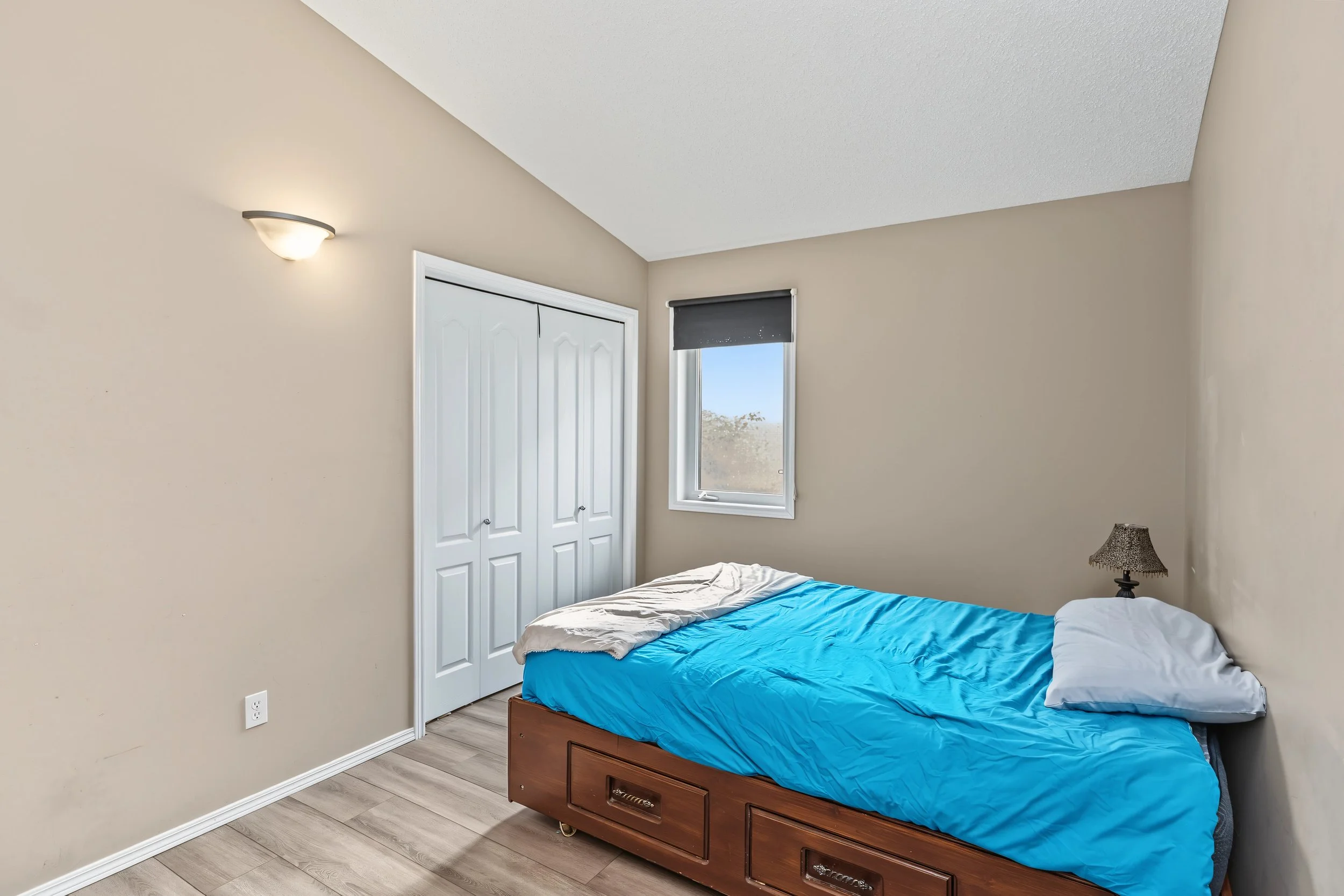 022 One of two bedrooms located on the main level.jpeg