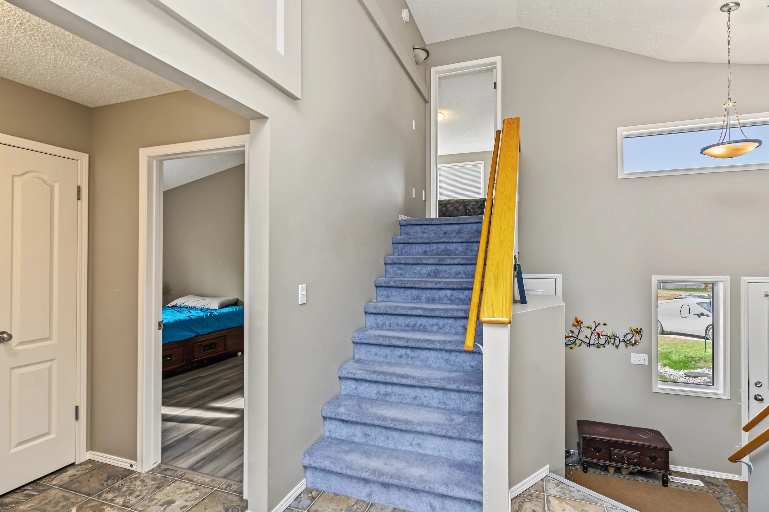 025 Primary suite set apart from the main-floor bedrooms.jpeg